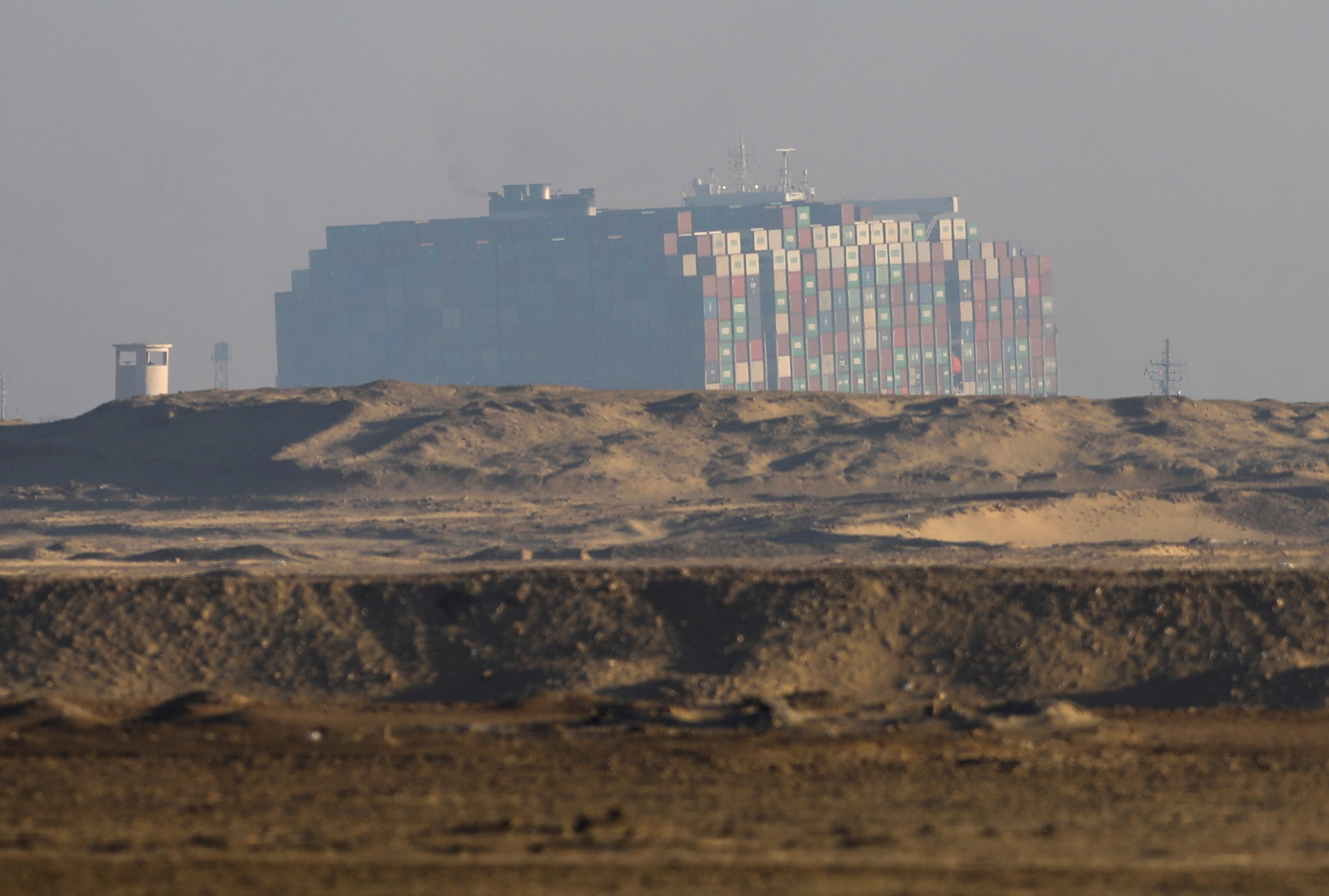 A view shows the refloated container ship Ever Given, one of the world's largest container ships, in Suez Canal, Egypt March 29, 2021. REUTERS