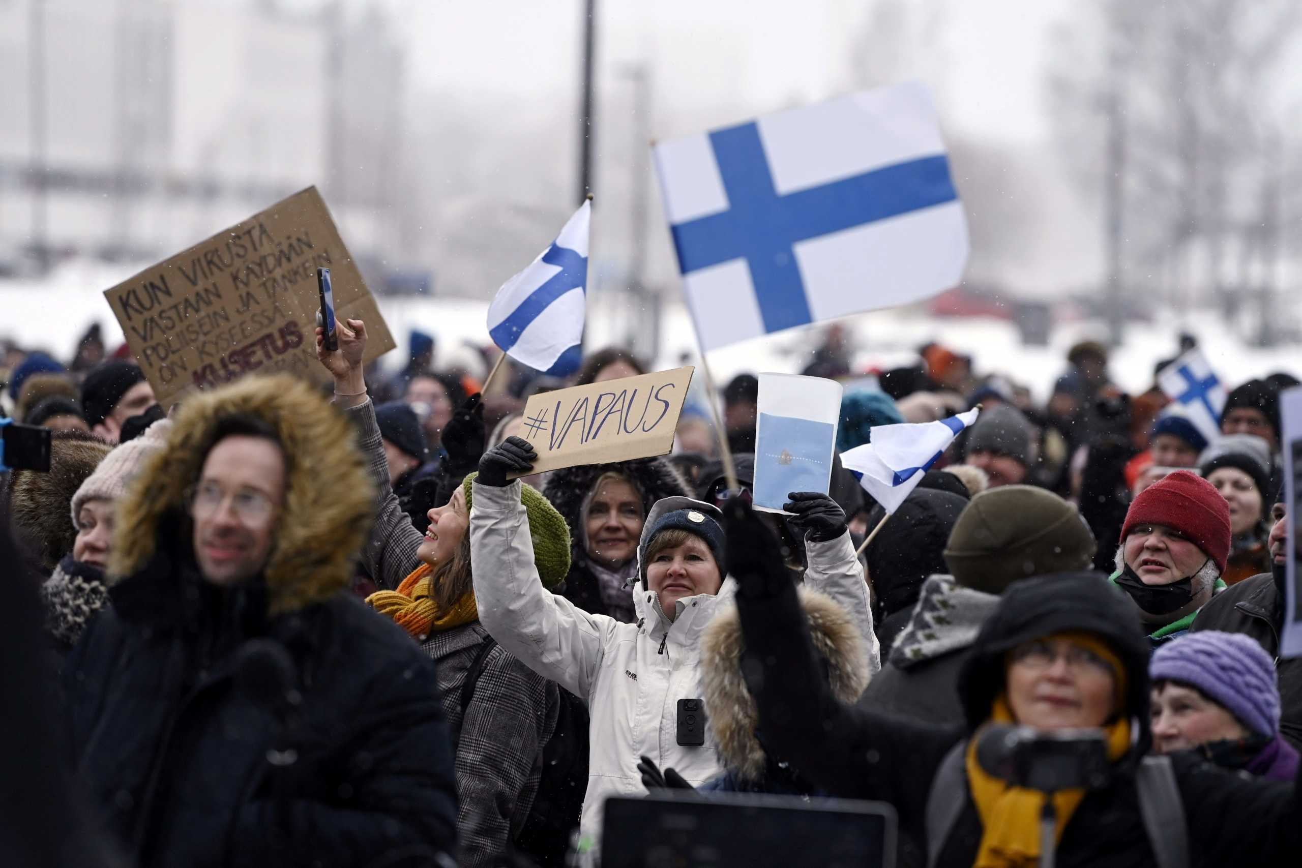 People protest against Finnish government's regulations to fight the coronavirus disease (COVID-19) pandemic, in Helsinki, Finland March 20, 2021. Lehtikuva