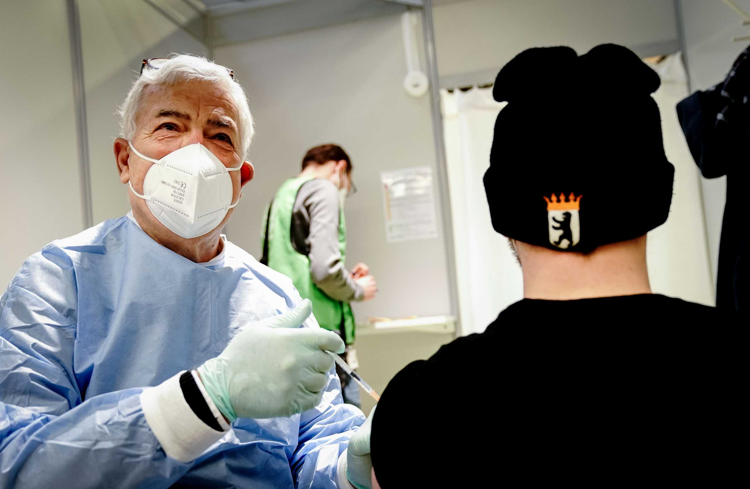 Doctor Wolfgang Meyer-Sabellek prepares the vaccination of a patient with AstraZeneca's COVID-19 vaccine at Berlin's former Tegel TXL airport, amid the spread of the coronavirus disease (COVID-19) in Berlin, Germany, February 10, 2021. Kay Nietfeld