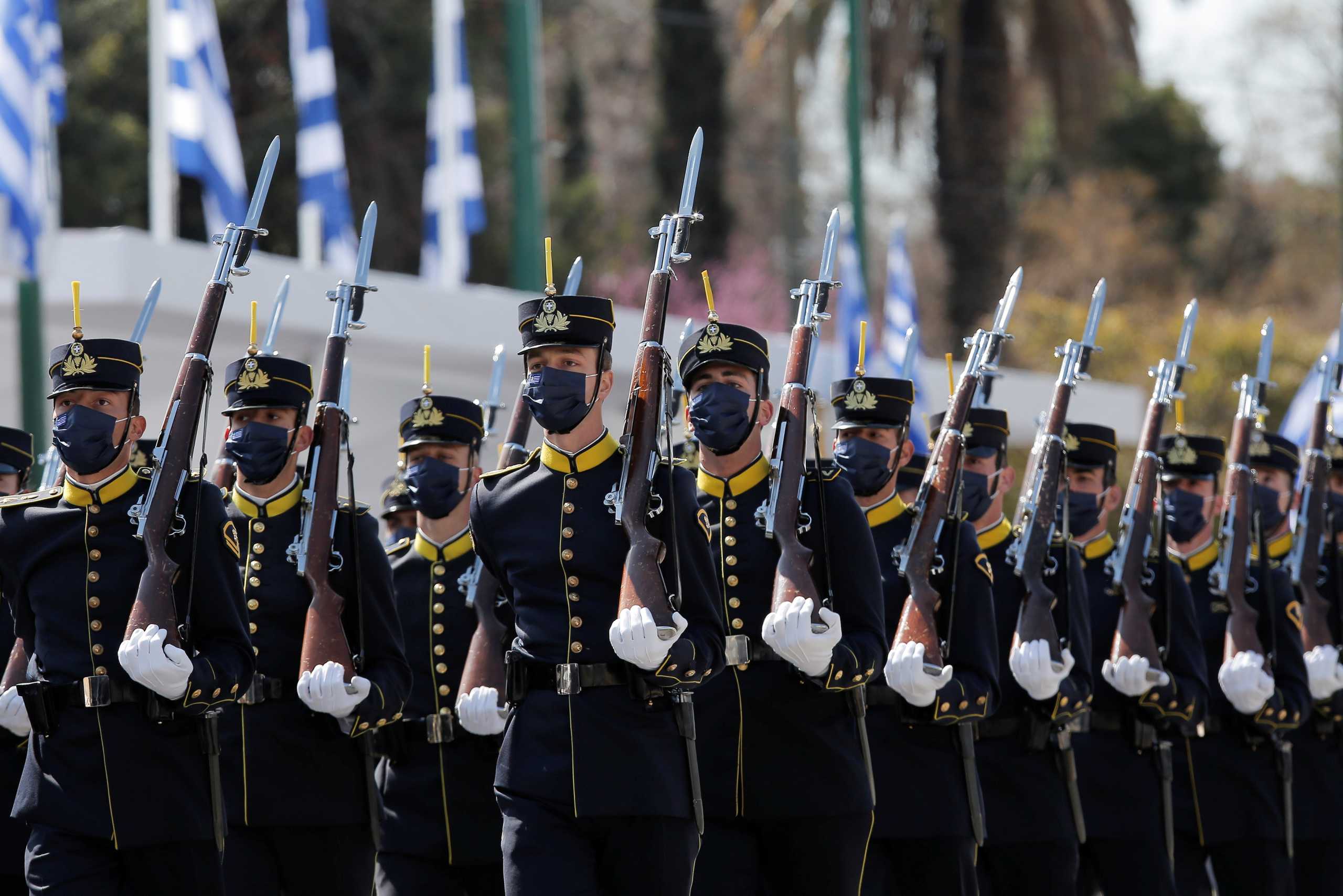 Military cadets march during a parade marking the 200th anniversary of the Greek War of Independence, in Athens, Greece March 25, 2021. Kostas Tsironis