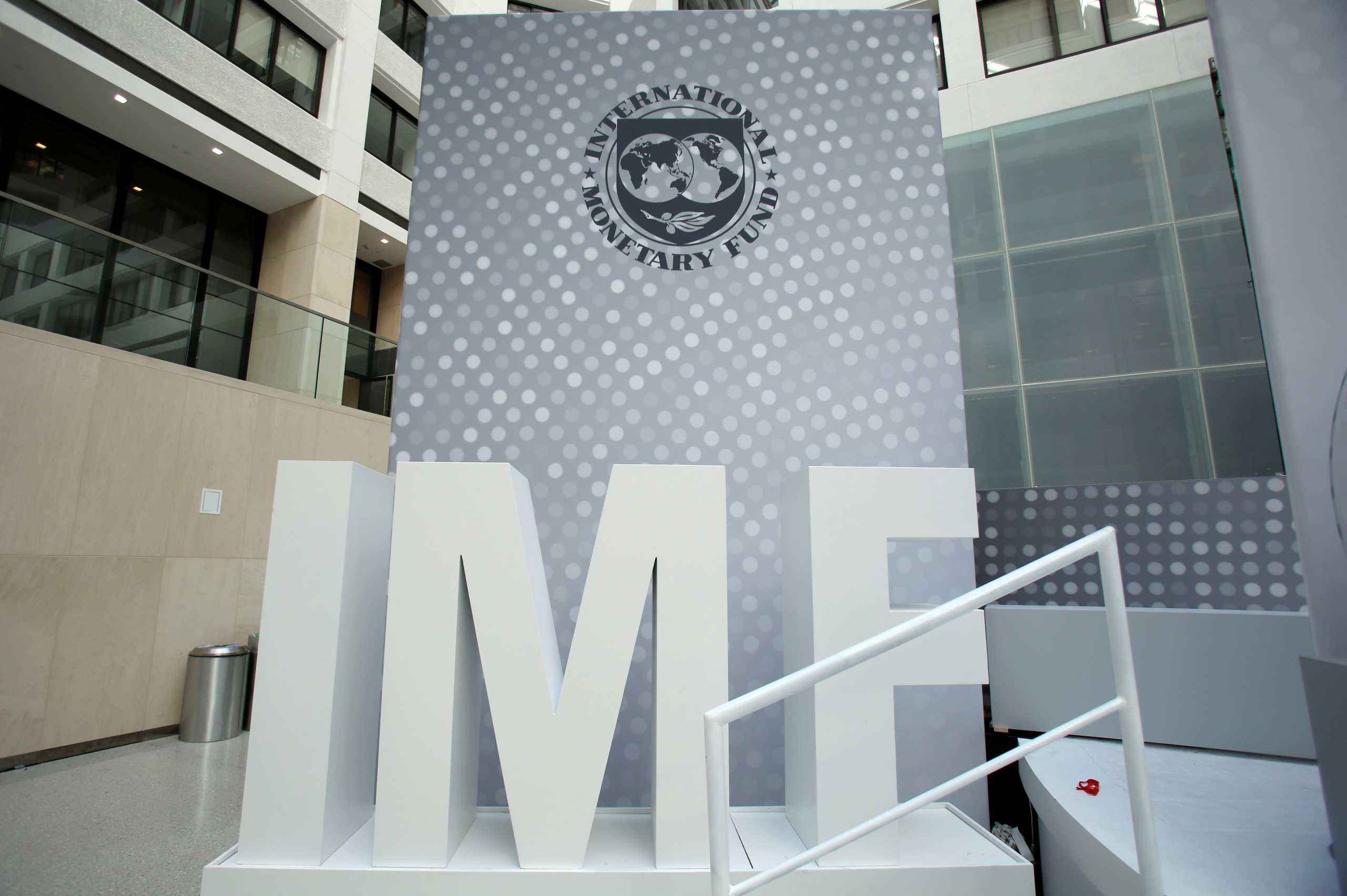 FILE PHOTO: International Monetary Fund logo is seen inside the headquarters at the end of the IMF