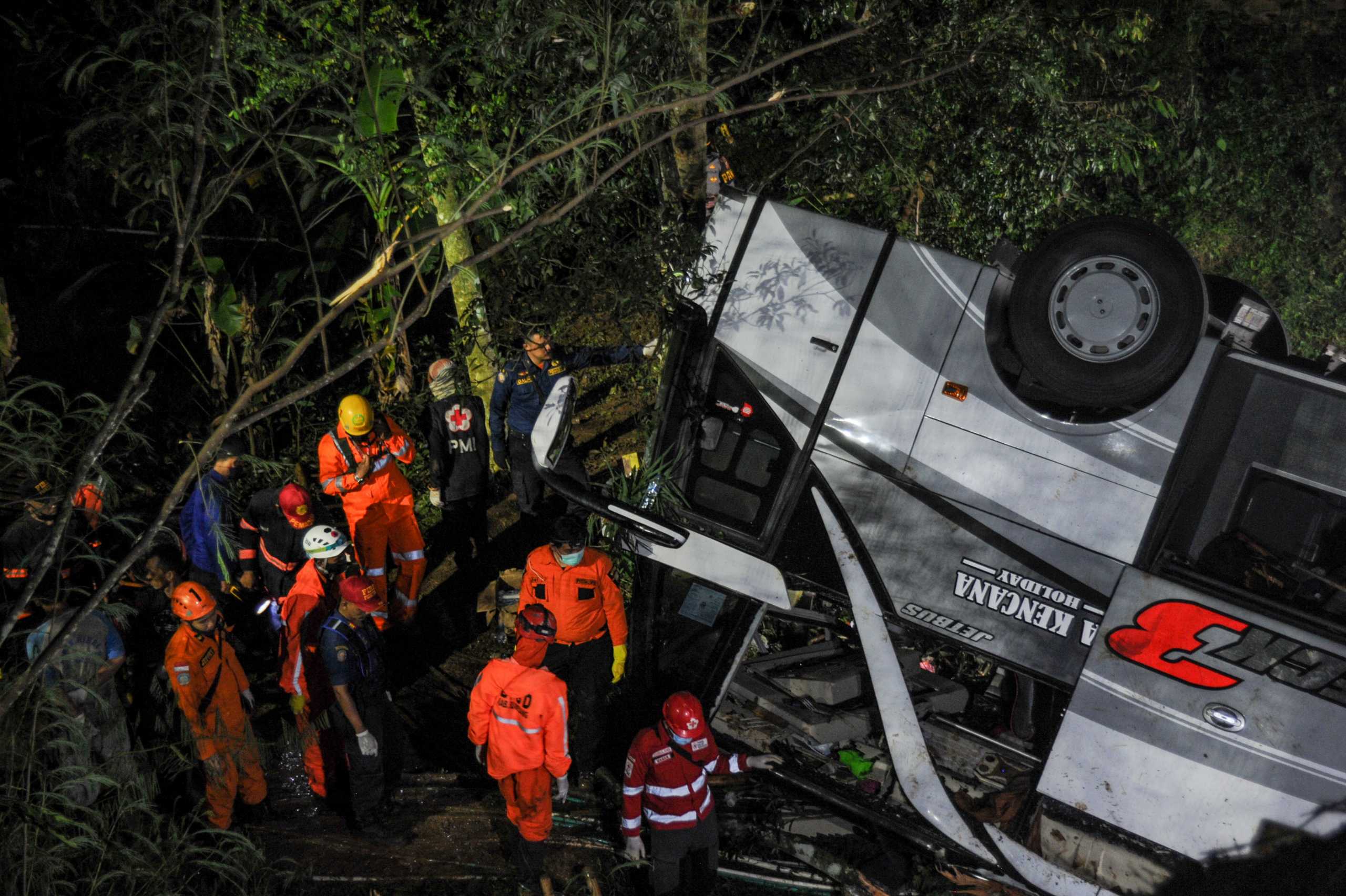 Rescue personnel work at the crash site after a bus fell into a ravine in Sumedang, West Java Province, Indonesia March 10, 2021, in this photo taken by Antara Foto. Picture taken March 10, 2021. Antara Foto