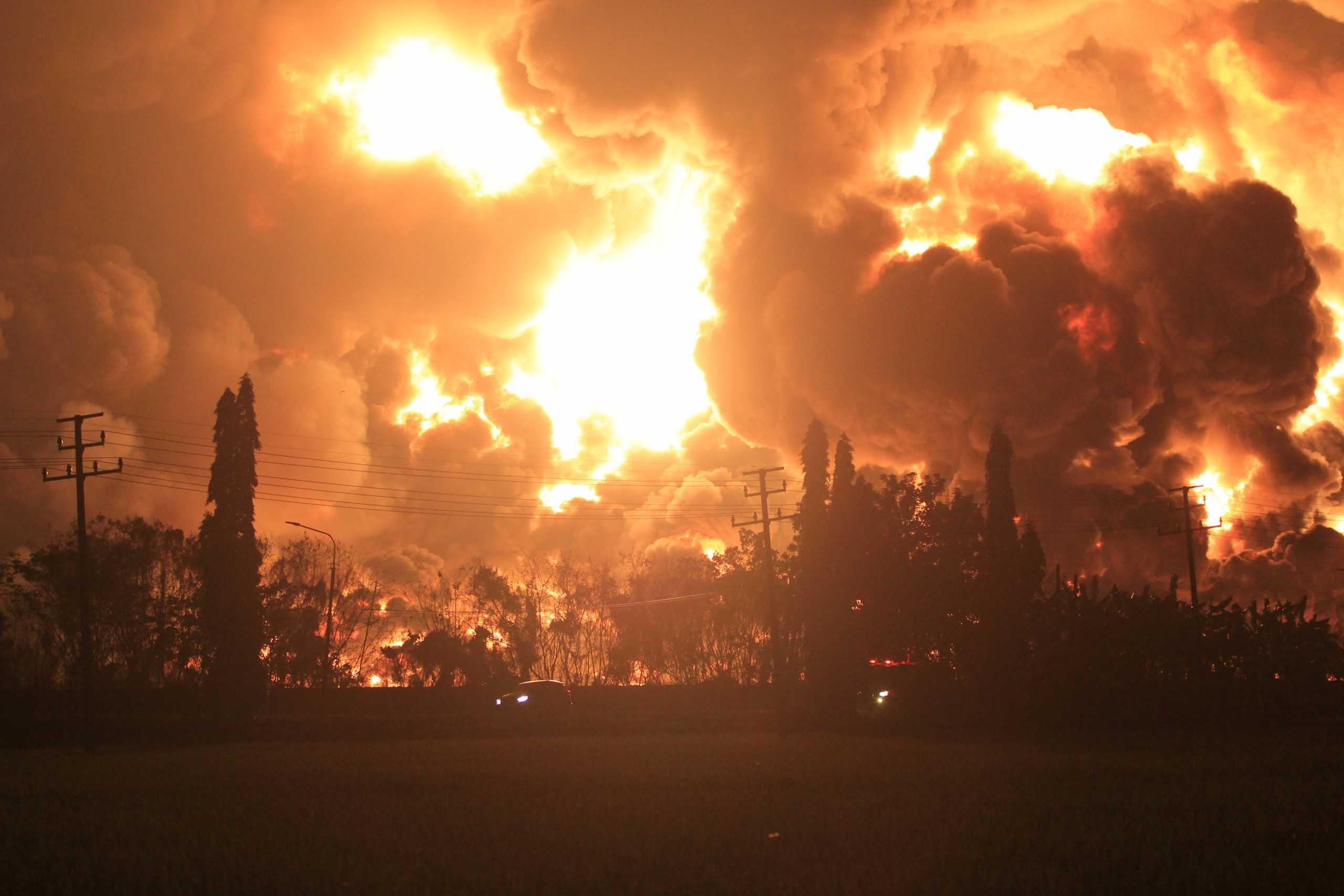 Smoke rises during fire at Pertamina's oil refinery in Balongan, Indramayu regency, West Java province, Indonesia, March 29, 2021 in this photo taken by Antara Foto.  Antara Foto