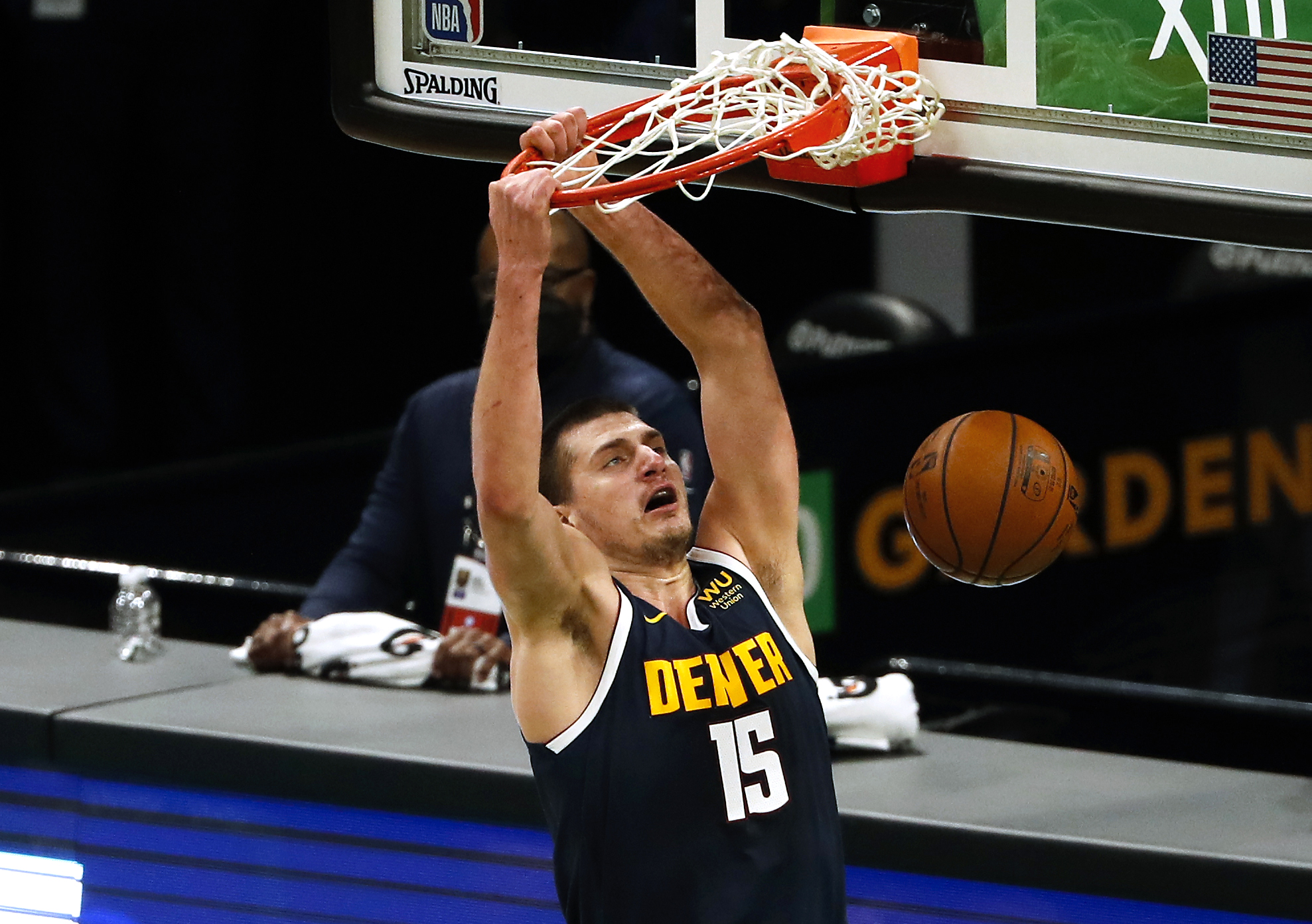 Feb 16, 2021; Boston, Massachusetts, USA; Denver Nuggets center Nikola Jokic (15) dunks against the Boston Celtics during the first quarter at TD Garden. Mandatory Credit: Winslow Townson-USA TODAY Sports