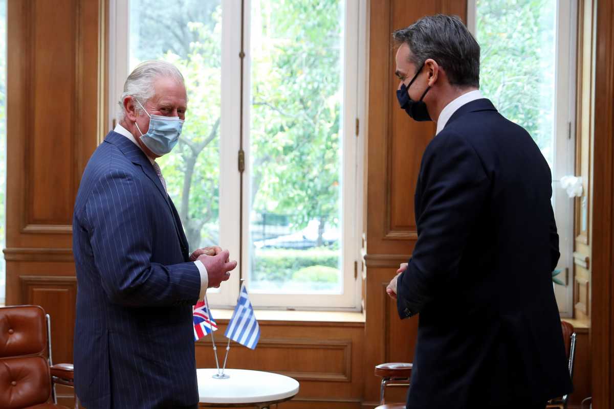 Greek Prime Minister Kyriakos Mitsotakis meets with Britain's Prince Charles at the Maximos Mansion during celebrations for the 200th anniversary of the Greek War of Independence, in Athens, Greece, March 25, 2021. REUTERS
