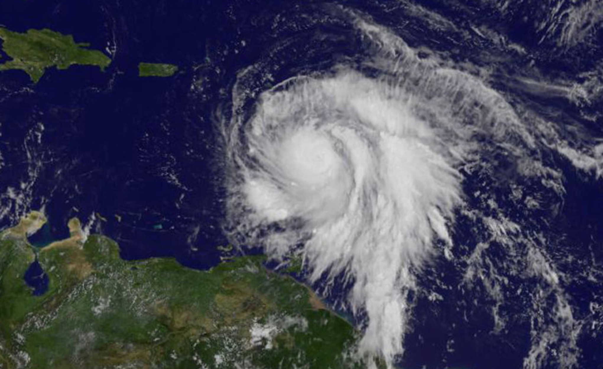 Hurricane Maria is shown in the Atlantic Ocean in this NOAA's GOES East satellite as it strengthened to a Category 3 hurricane just east of the Leeward Islands at 10:45 a.m. EDT (1445 UTC) on September 18, 2017.     Courtesy NASA