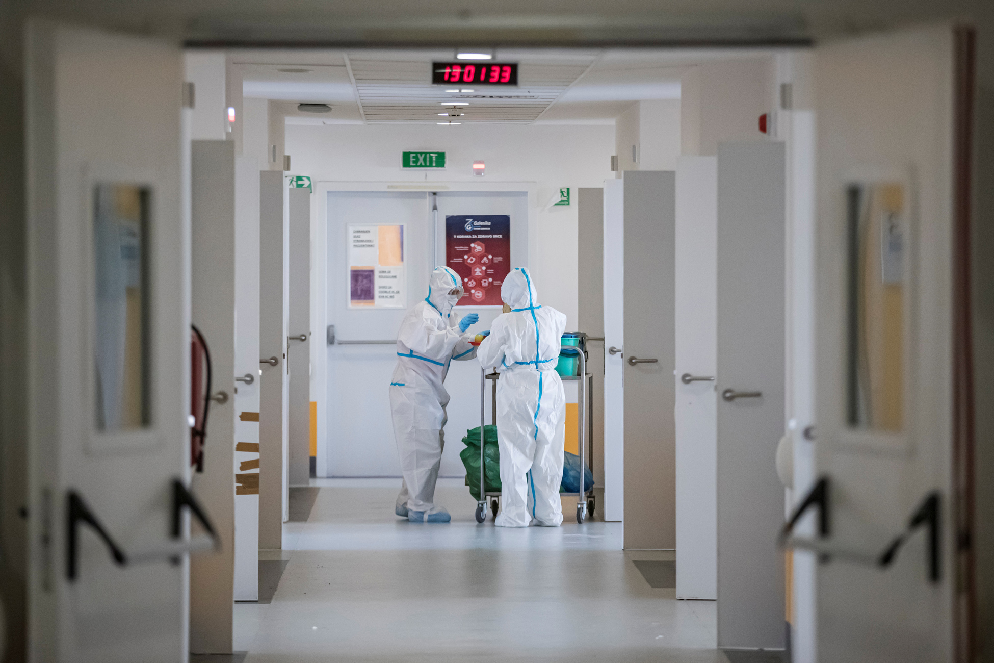 Medical workers stand at the intensive care unit of the Clinical Hospital Center, where they treat patients suffering from the coronavirus disease (COVID-19), in Nis, Serbia, March 3, 2021. REUTERS