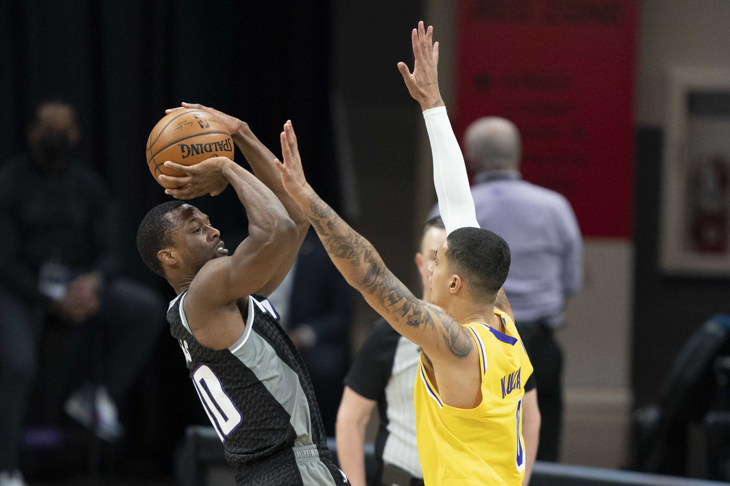 March 3, 2021; Sacramento, California, USA; Sacramento Kings forward Harrison Barnes (40) shoots the basketball against Los Angeles Lakers forward Kyle Kuzma (0)  during the first quarter at Golden 1 Center. Mandatory Credit: Kyle Terada-USA TODAY Sports