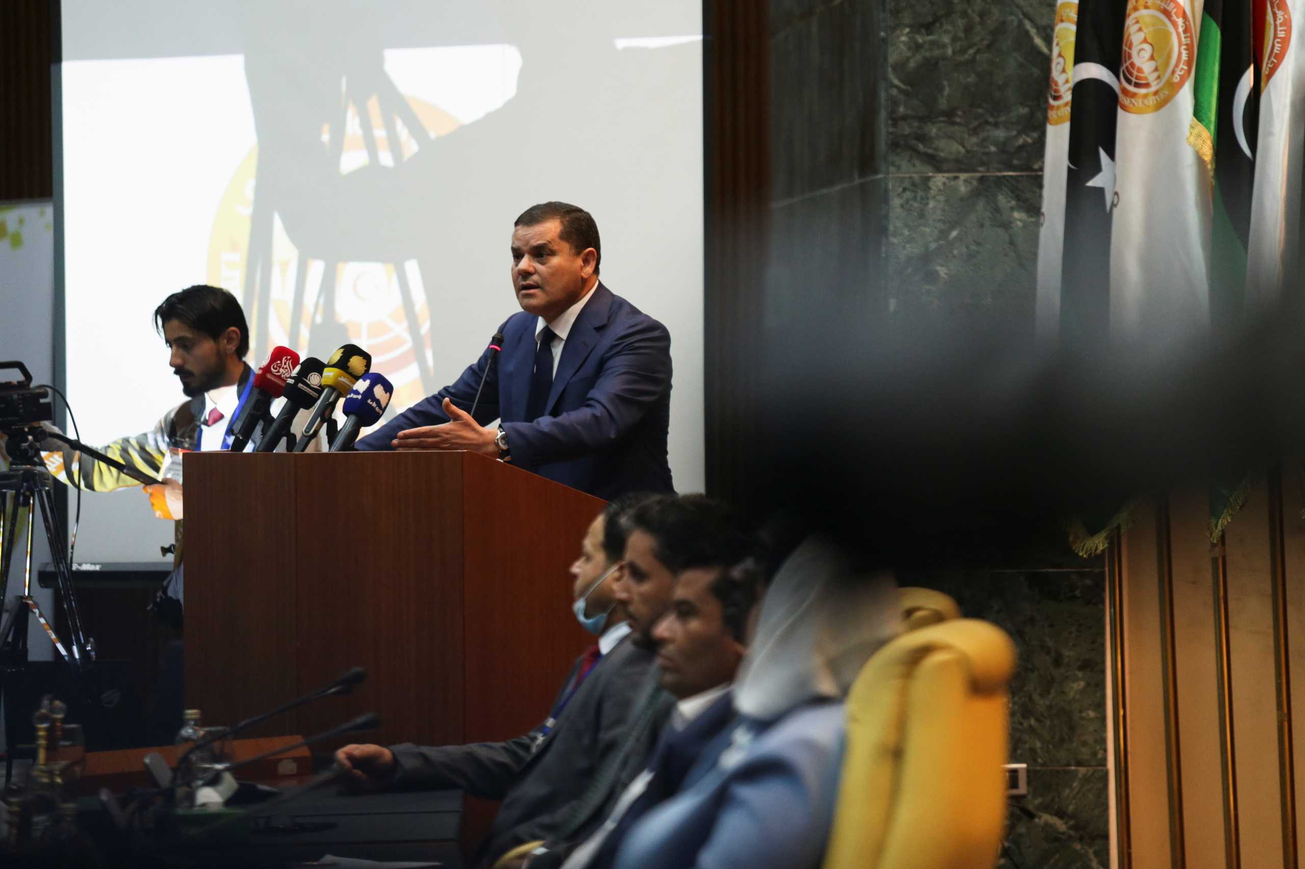 Libya's new Prime Minister Abdulhamid Dbeibeh gestures as he speaks in parliament in Sirte, Libya March 9, 2021. REUTERS