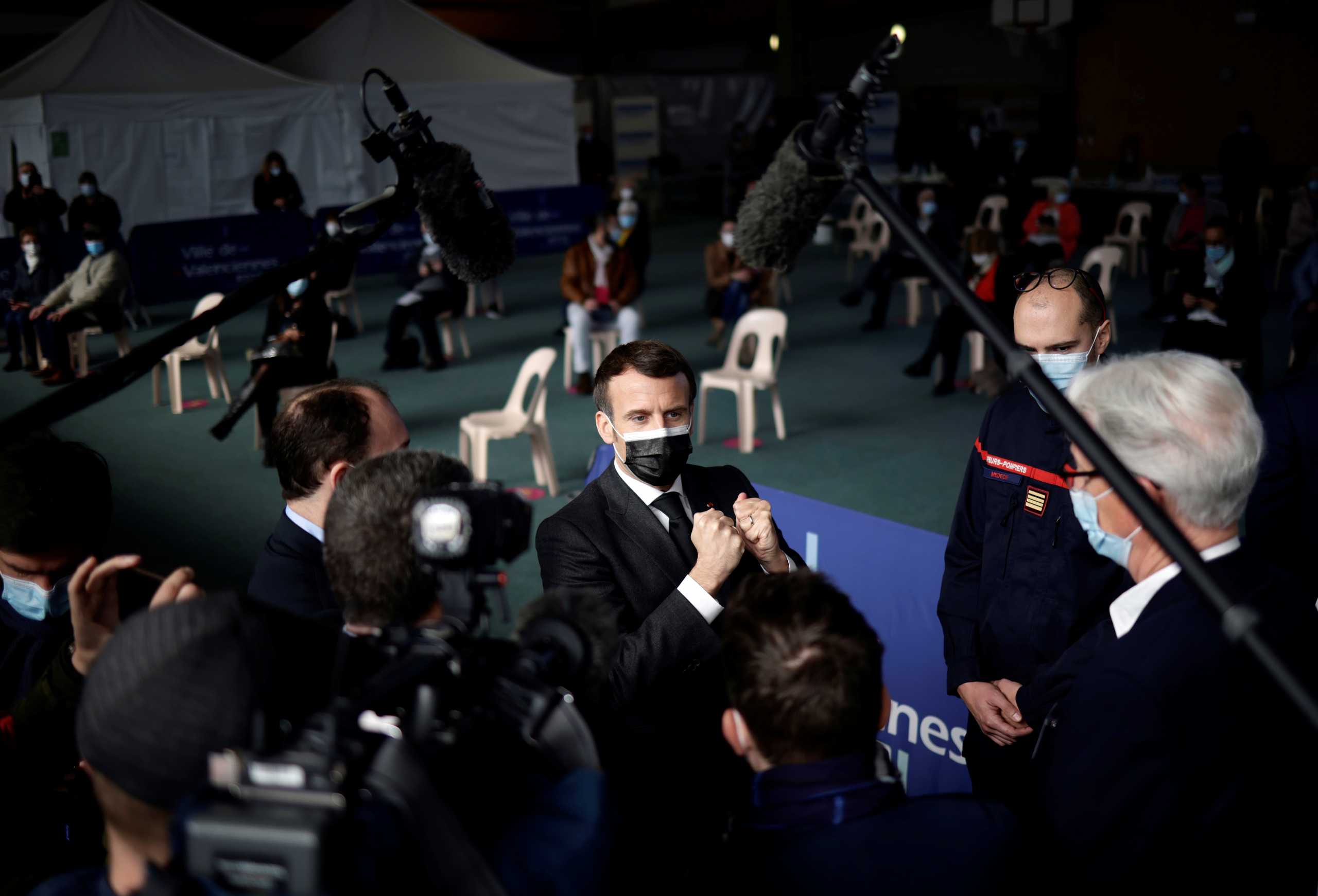 French President Emmanuel Macron visits a COVID-19 vaccination center in Valenciennes, France March 23, 2021. Yoan Valat