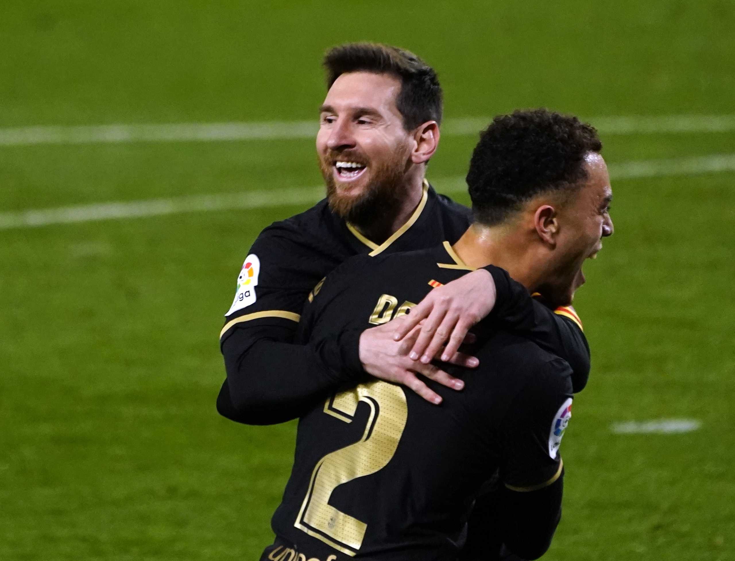 Soccer Football - La Liga Santander - Real Sociedad v FC Barcelona - Reale Arena, San Sebastian, Spain - March 21, 2021 FC Barcelona's Sergino Dest celebrates scoring their third goal with Lionel Messi REUTERS