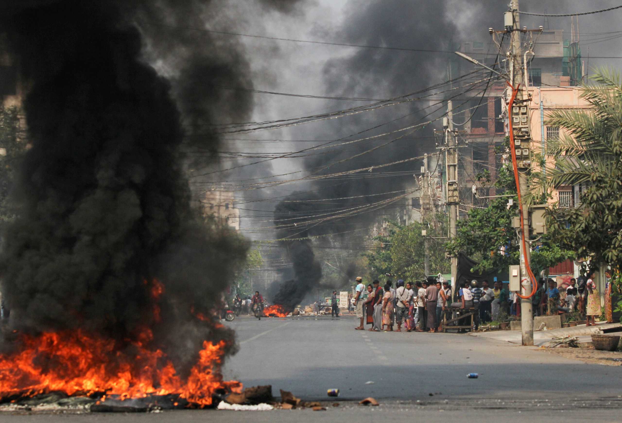 Tires burn on a street as protests against the military coup continue, in Mandalay, Myanmar March 27, 2021. REUTERS