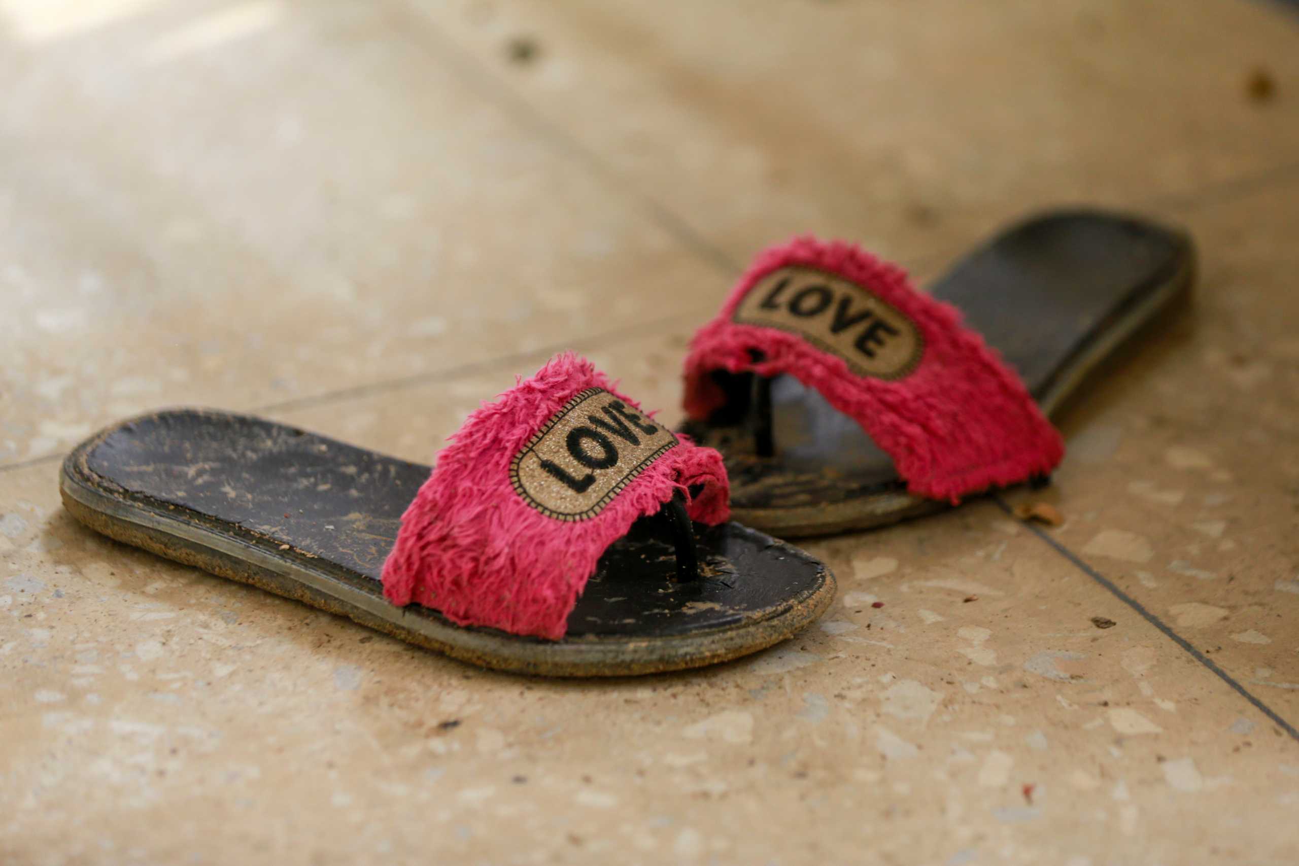 A pair of slippers belonging to one of the JSS Jangebe school girls is seen a day after over 300 school girls were abducted by bandits, in Zamfara, Nigeria February 27, 2021. REUTERS