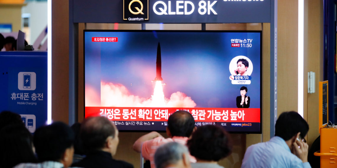 People watch a TV that shows a file picture of a North Korean missile for a news report on North Korea firing short-range ballistic missiles, in Seoul, South Korea, July 31, 2019.    REUTERS