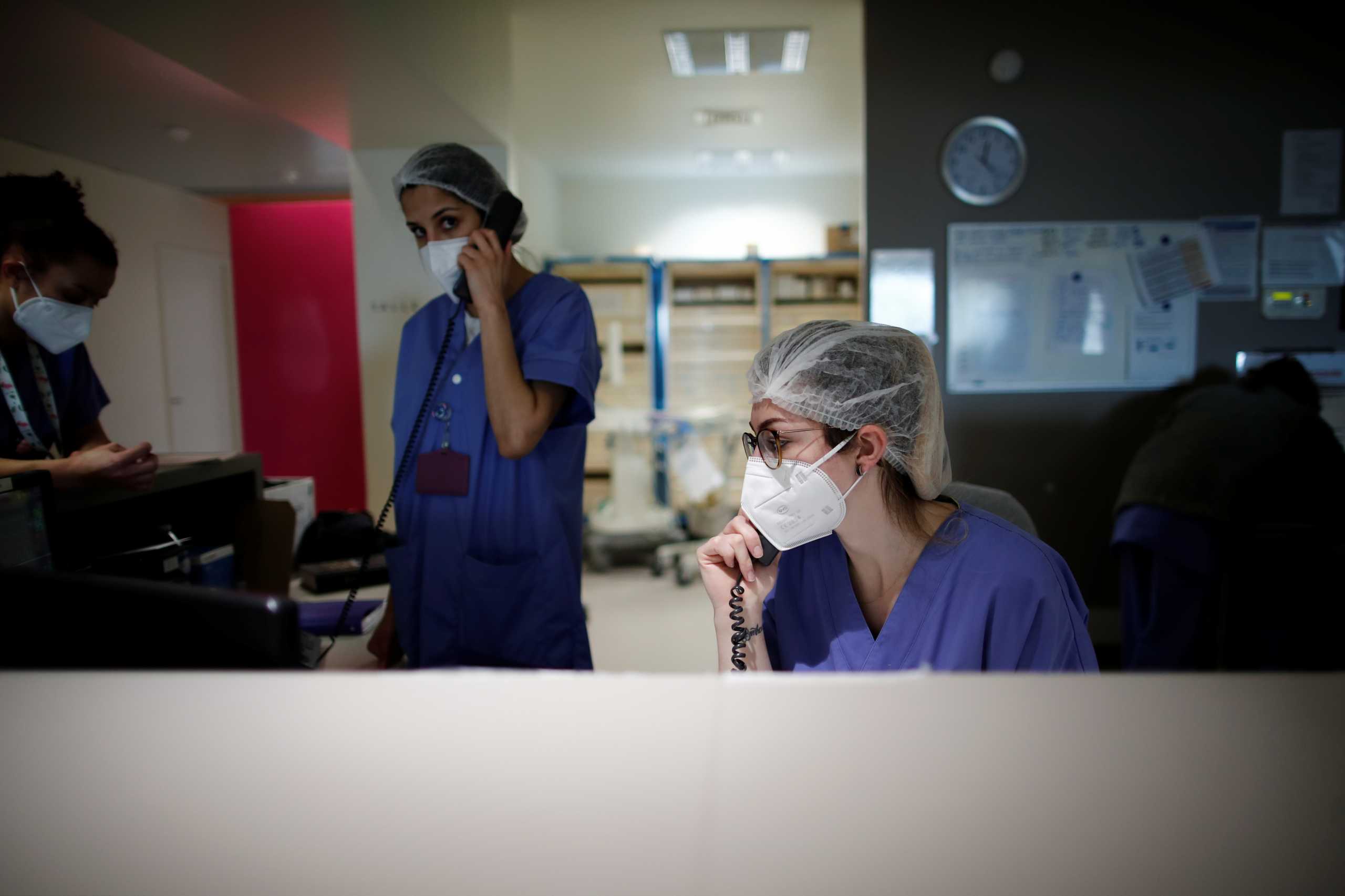 Medical staff members work in the Intensive Care Unit (ICU) where patients suffering from the coronavirus disease (COVID-19) are treated at the Melun-Senart hospital, near Paris, France, March 8, 2021. REUTERS