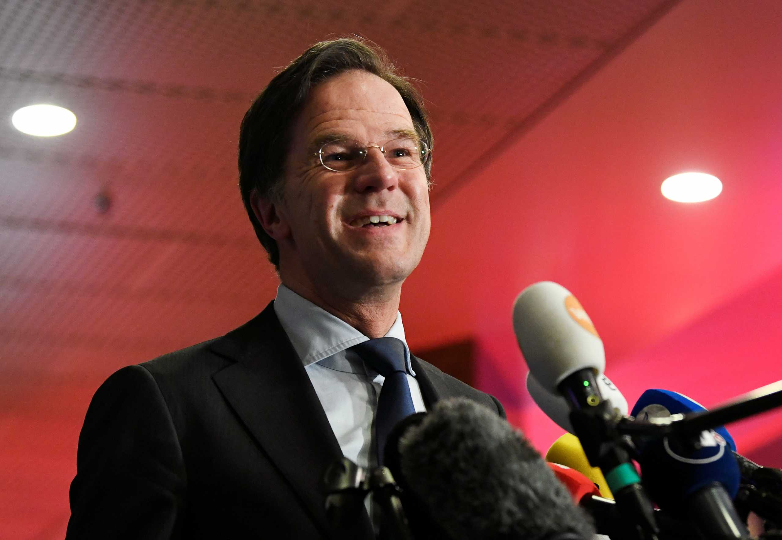 Dutch Prime Minister Mark Rutte reacts to the exit polls in the Netherlands' general election in The Hague, Netherlands, March 17, 2021. REUTERS