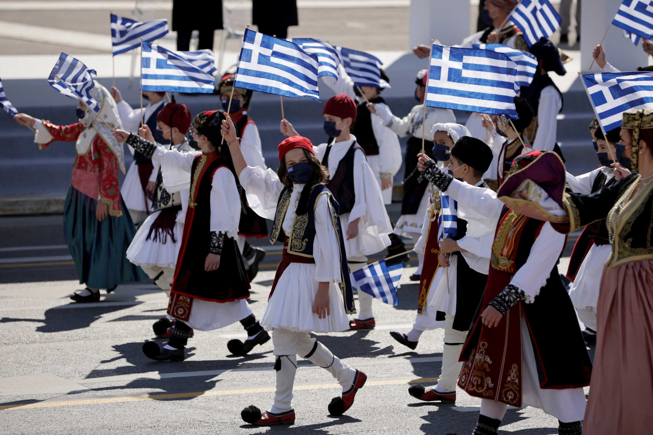Children march in traditional uniforms during a military parade marking the 200th anniversary of the Greek War of Independence, in Athens, Greece March 25, 2021. REUTERS