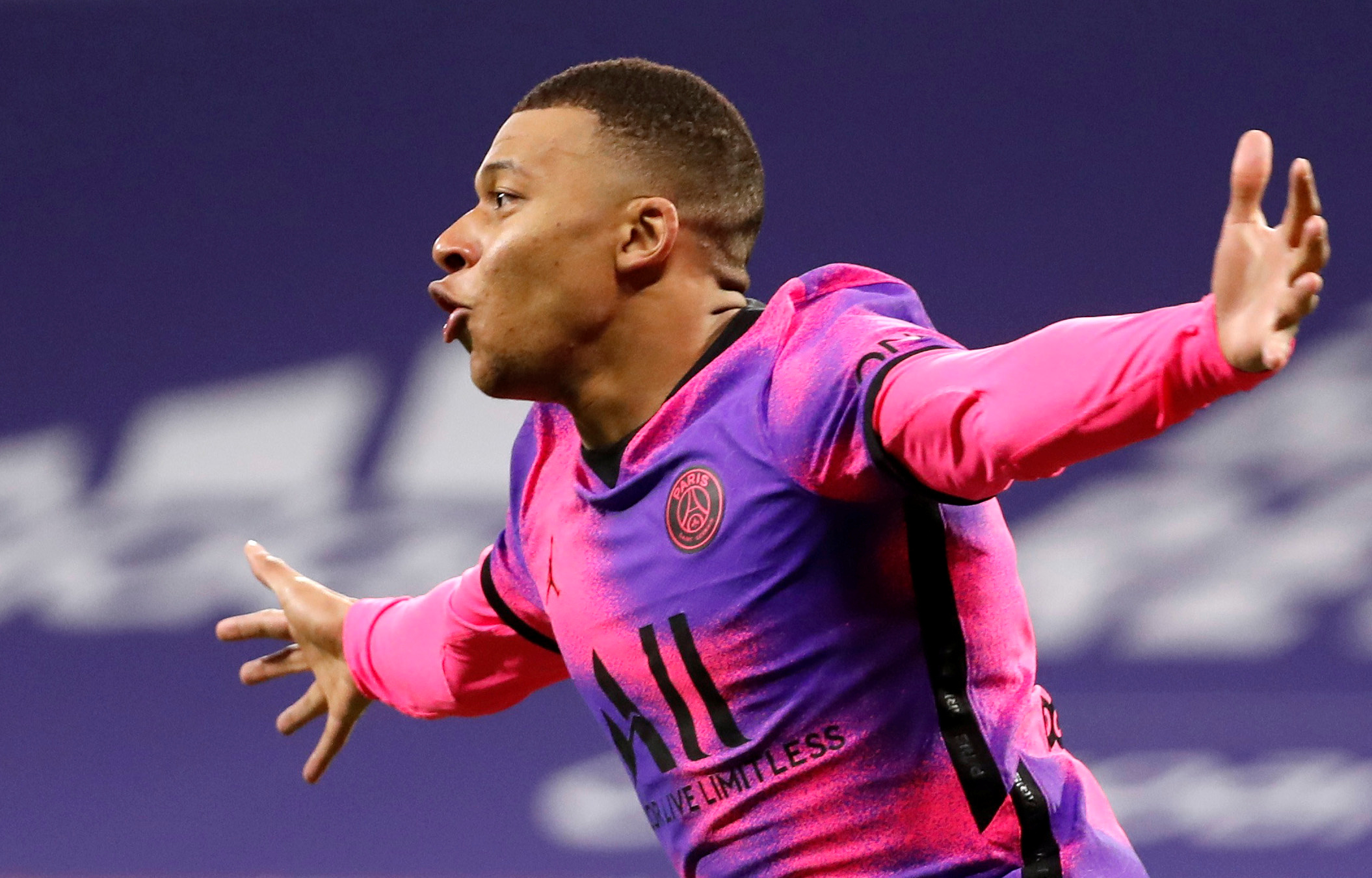 Soccer Football - Ligue 1 - Olympique Lyonnais v Paris St Germain - Groupama Stadium, Lyon, France - March 21, 2021 Paris St Germain's Kylian Mbappe celebrates scoring their fourth goal REUTERS