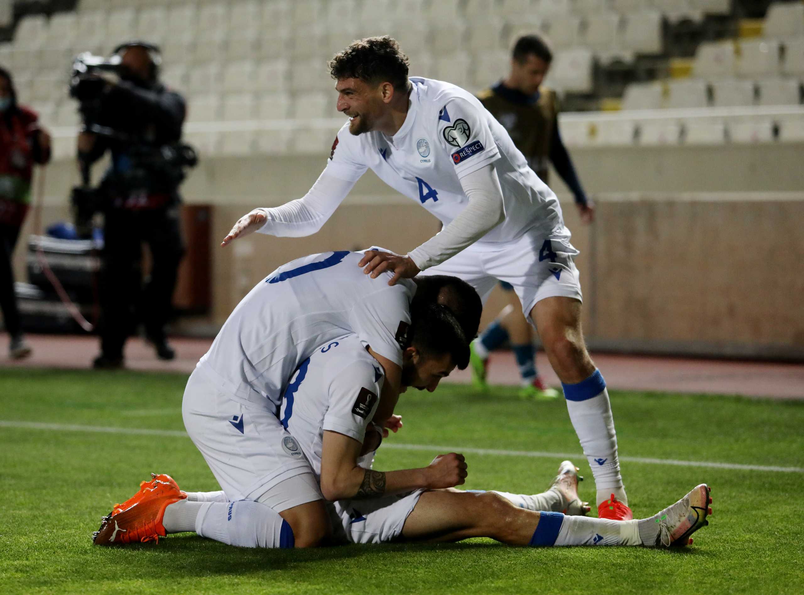 Soccer Football - World Cup Qualifiers Europe - Group H - Cyprus v Slovenia - GSP Stadium, Strovolos, Cyprus - March 30, 2021 Cyprus' Ioannis Pittas celebrates scoring their first goal with teammates REUTERS