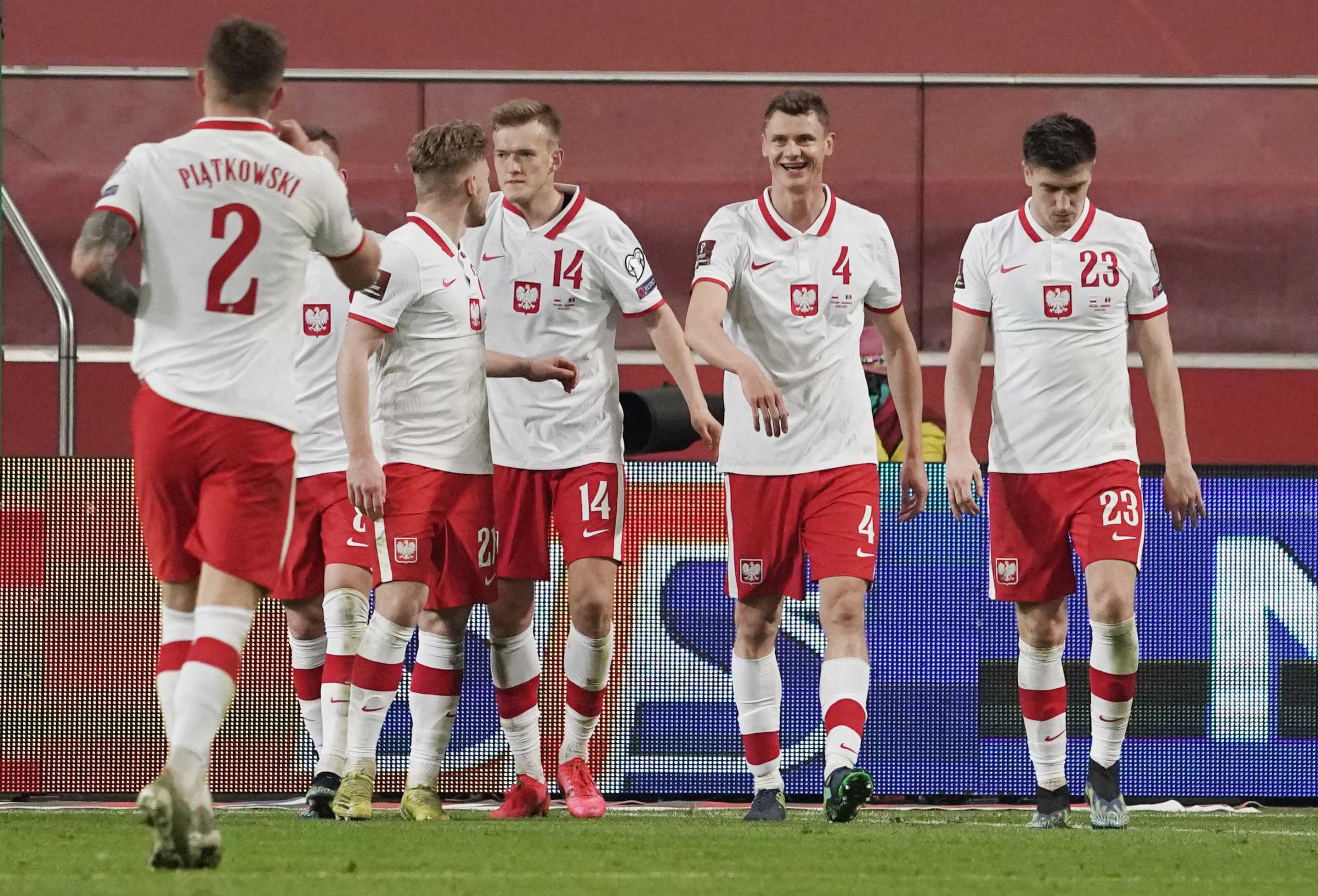 Soccer Football - World Cup Qualifiers Europe - Group I - Poland v Andorra - Polish Army Stadium, Warsaw, Poland - March 28, 2021 Poland's Karol Swiderski celebrates scoring their third goal with teammates REUTERS