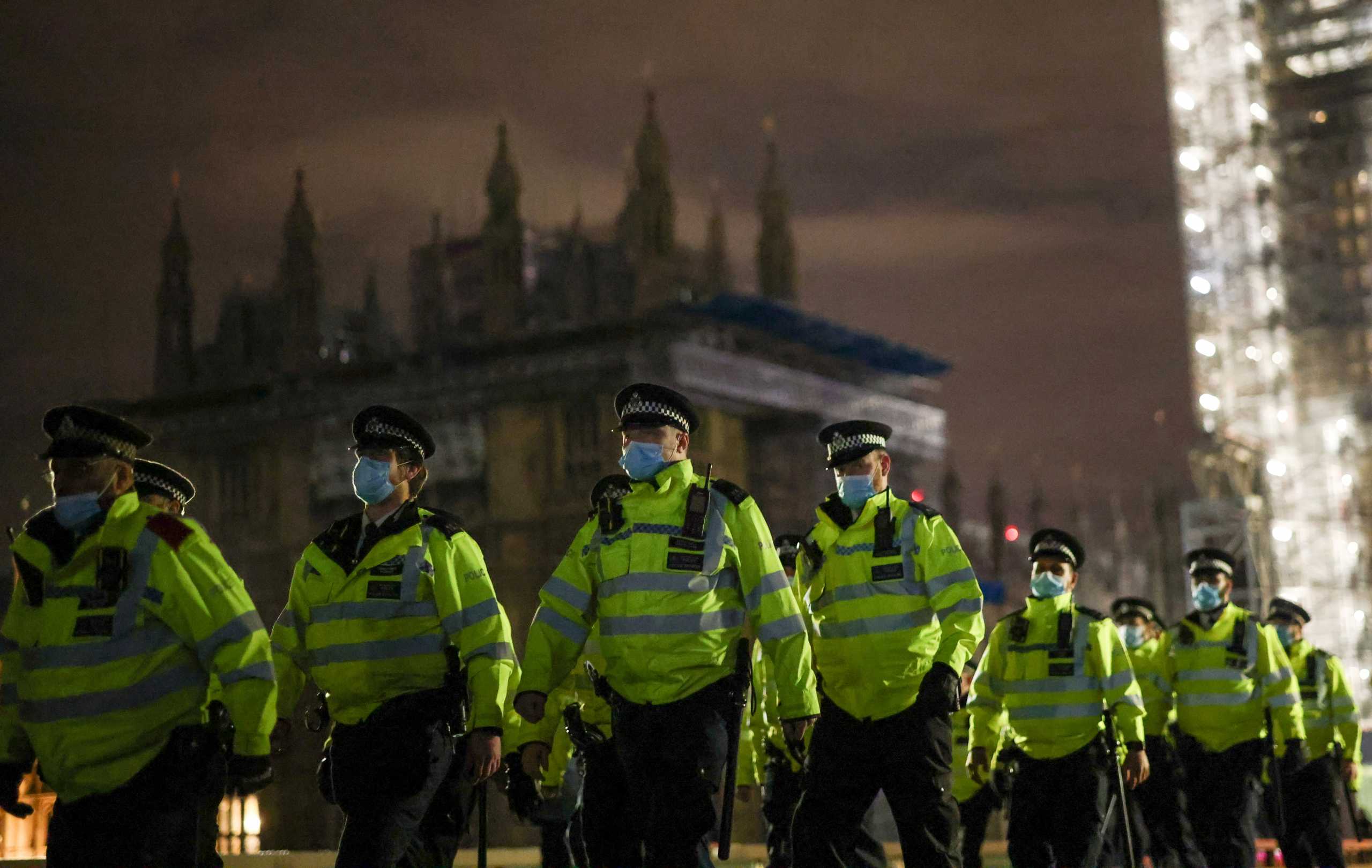 Police officers cross Westminster Bridge during a protest, following the kidnap and murder of Sarah Everard, in London, Britain March 15, 2021. REUTERS
