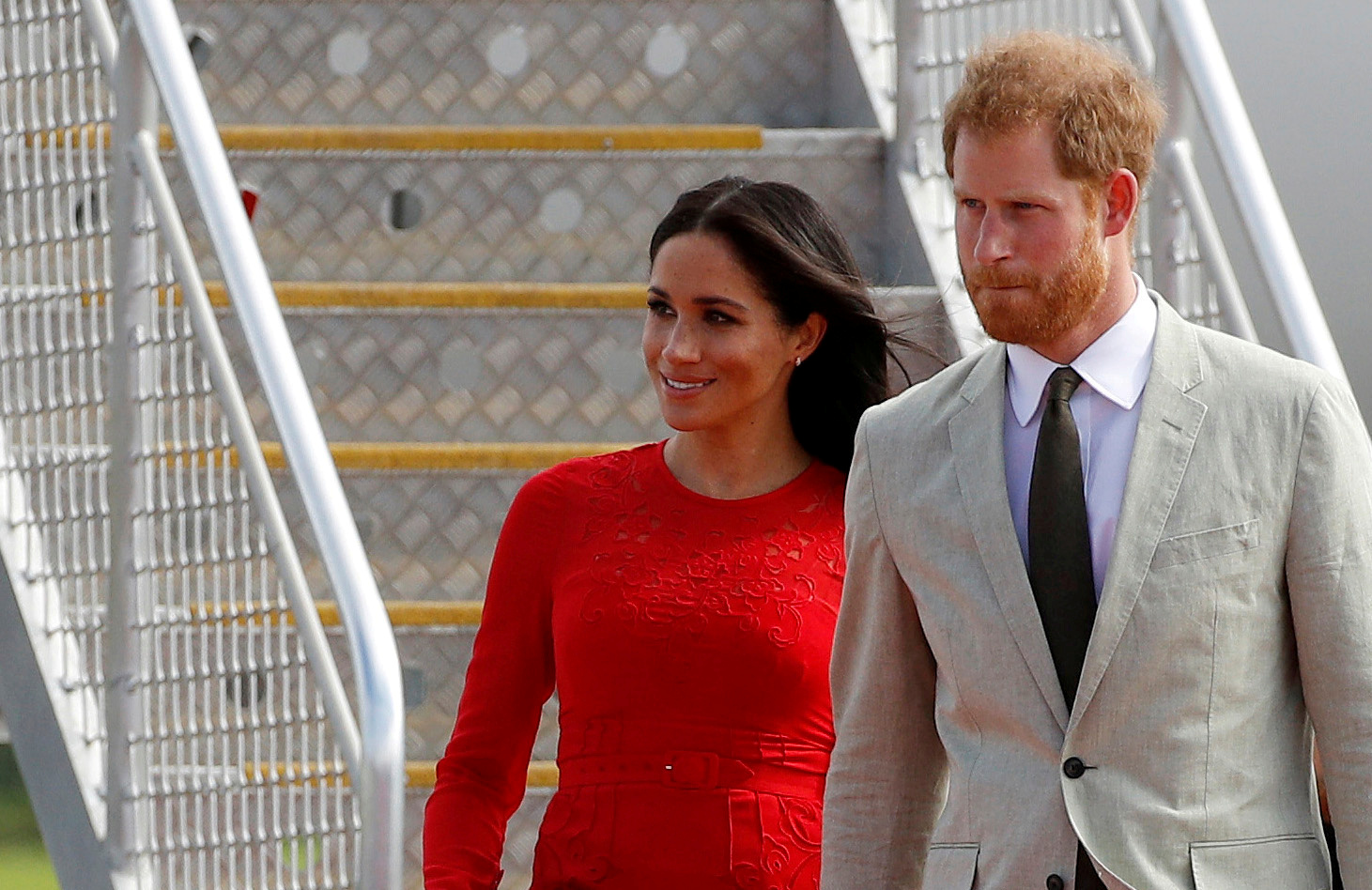 FILE PHOTO: Britain's Prince Harry and Meghan, Duchess of Sussex, arrive at Fua'amotu airport on the main island Tongatapu in Tonga October 25, 2018. REUTERS