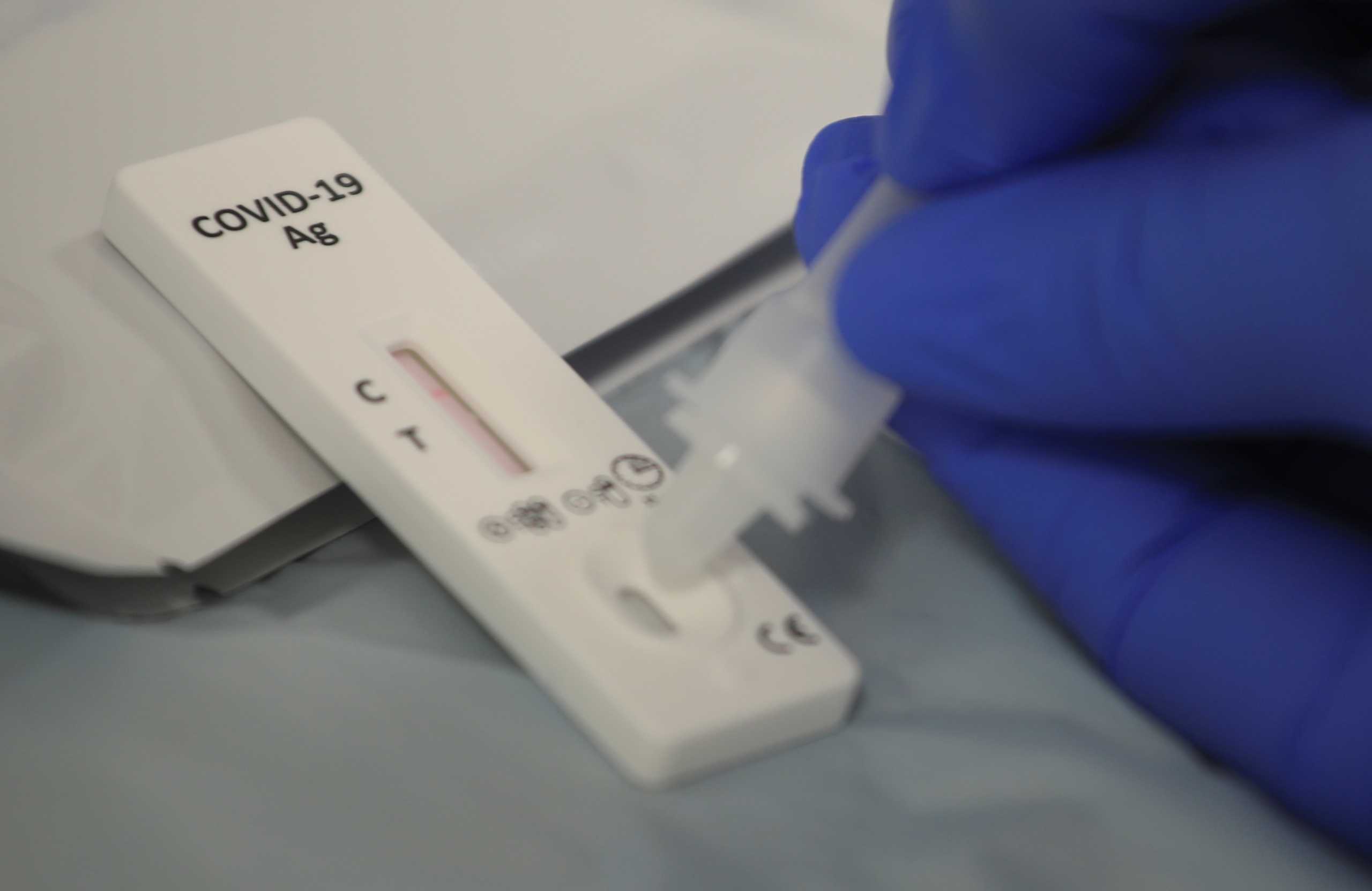 A medical assistant performs a COVID-19 rapid test at the RWE headquarters in Essen, Germany, March 11, 2021.    REUTERS