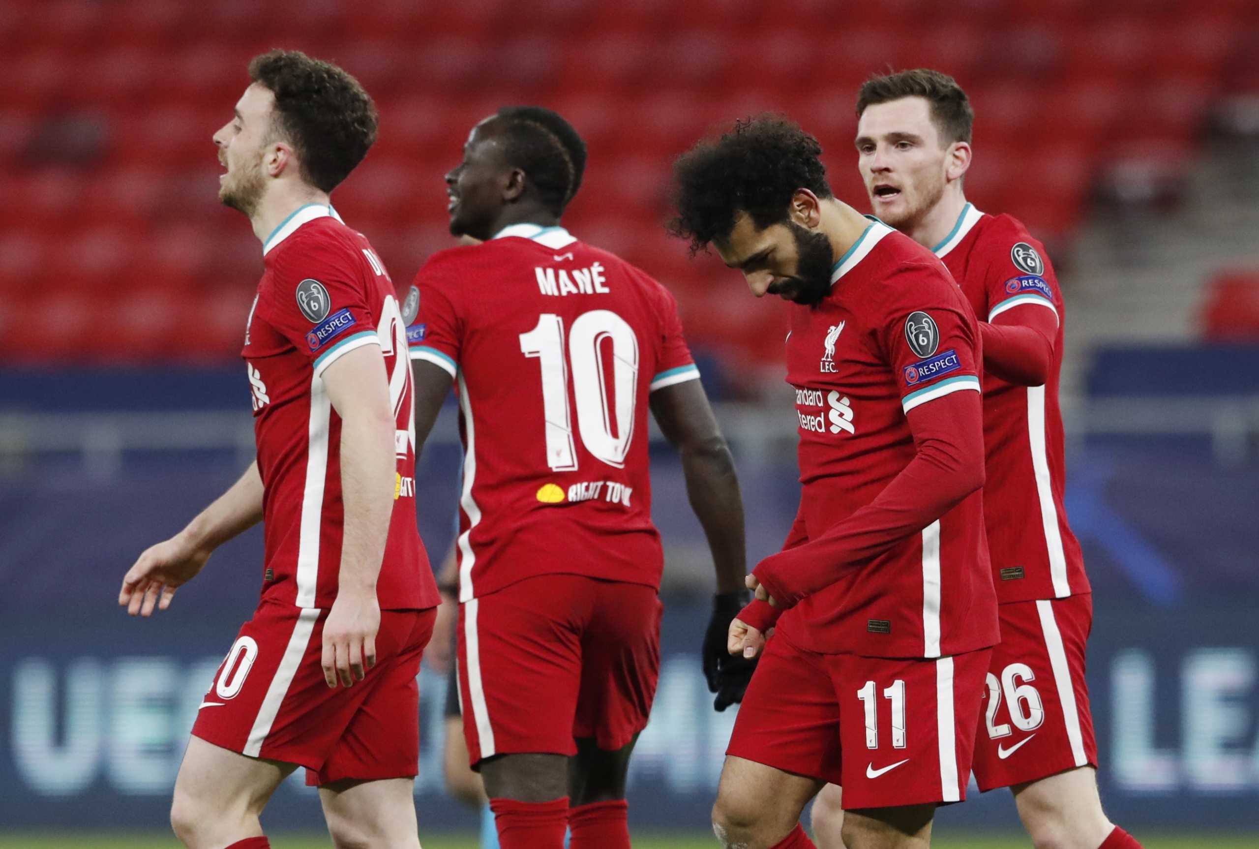 Soccer Football - Champions League - Round of 16 Second Leg - Liverpool v RB Leipzig - Puskas Arena, Budapest, Hungary - March 10, 2021 Liverpool's Mohamed Salah celebrates scoring their first goal with teammates REUTERS