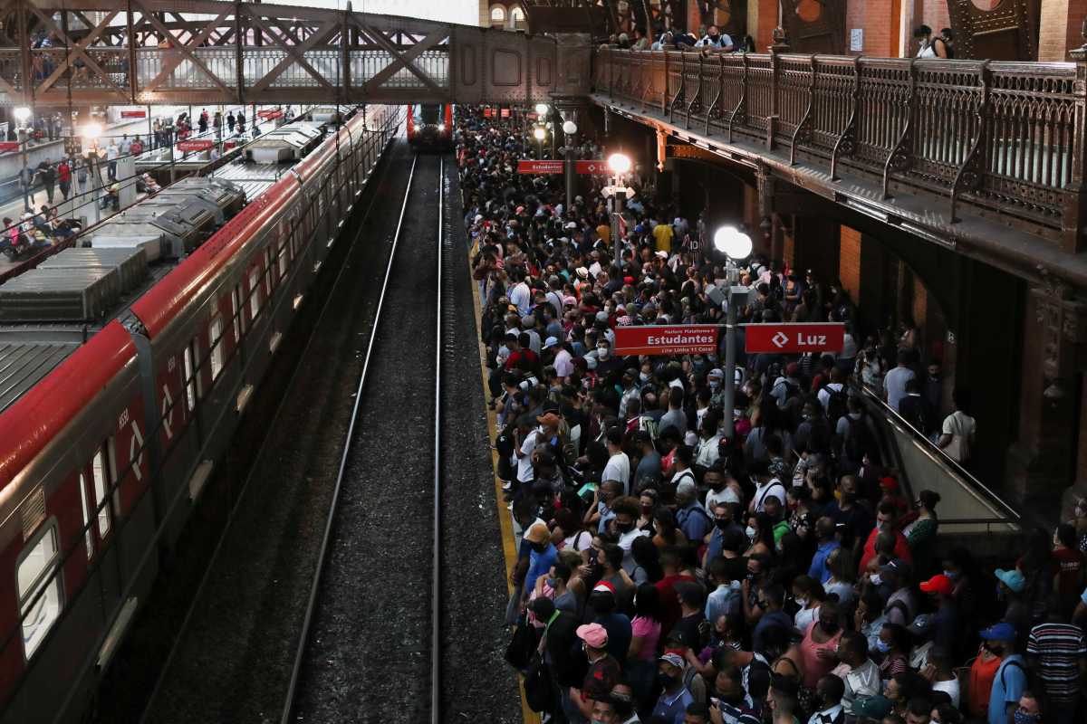People gather to board a train at Luz station during the outbreak of the coronavirus disease (COVID-19) in Sao Paulo, Brazil March 4, 2021. REUTERS