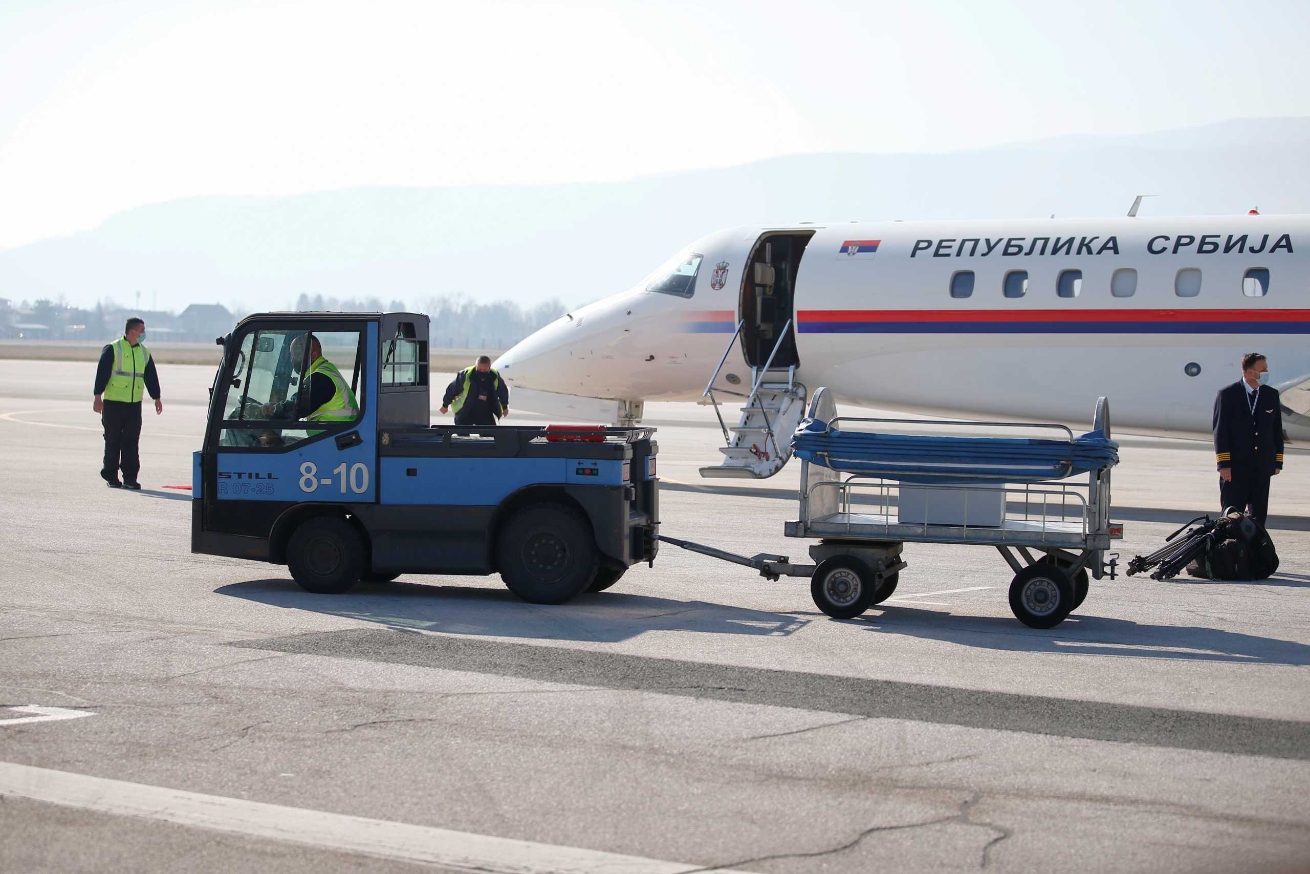 A vehicle transports boxes containing vaccines against the coronavirus disease (COVID-19) donated by Serbia's president Aleksandar Vucic, at Sarajevo International Airport in Sarajevo, Bosnia and Herzegovina, March 2, 2021. REUTERS