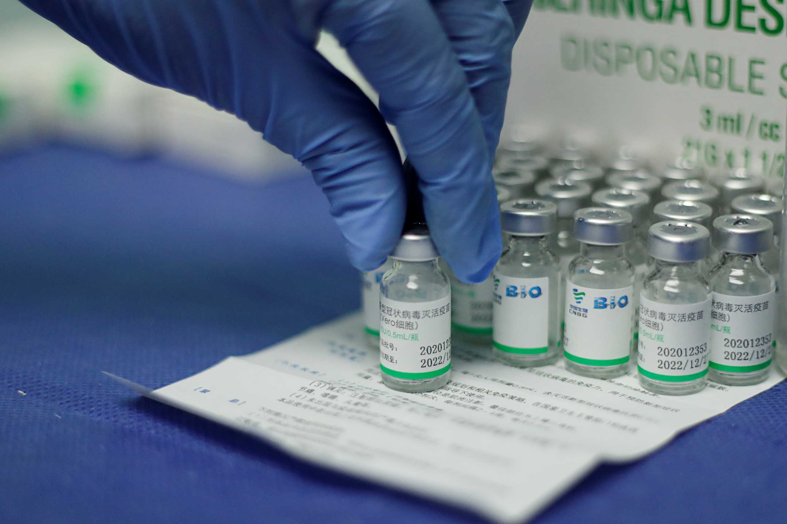FILE PHOTO: A nurse holds a vial of China's Sinopharm coronavirus disease (COVID-19) vaccine at a health center in Caracas, Venezuela March 7, 2021. REUTERS