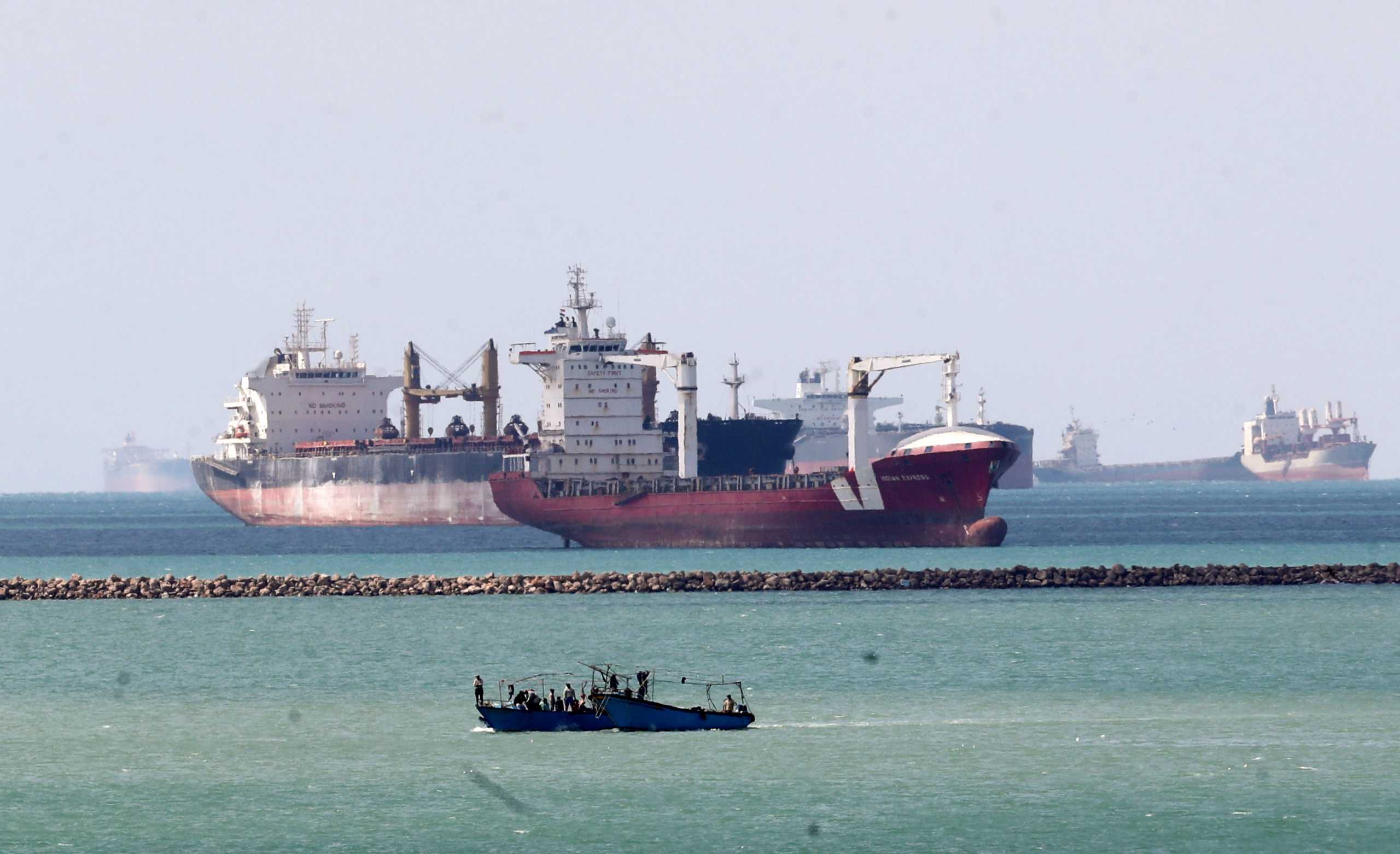 Ships and boats are seen at the entrance of Suez Canal, which was blocked by stranded container ship Ever Given that ran aground, Egypt March 28, 2021. REUTERS