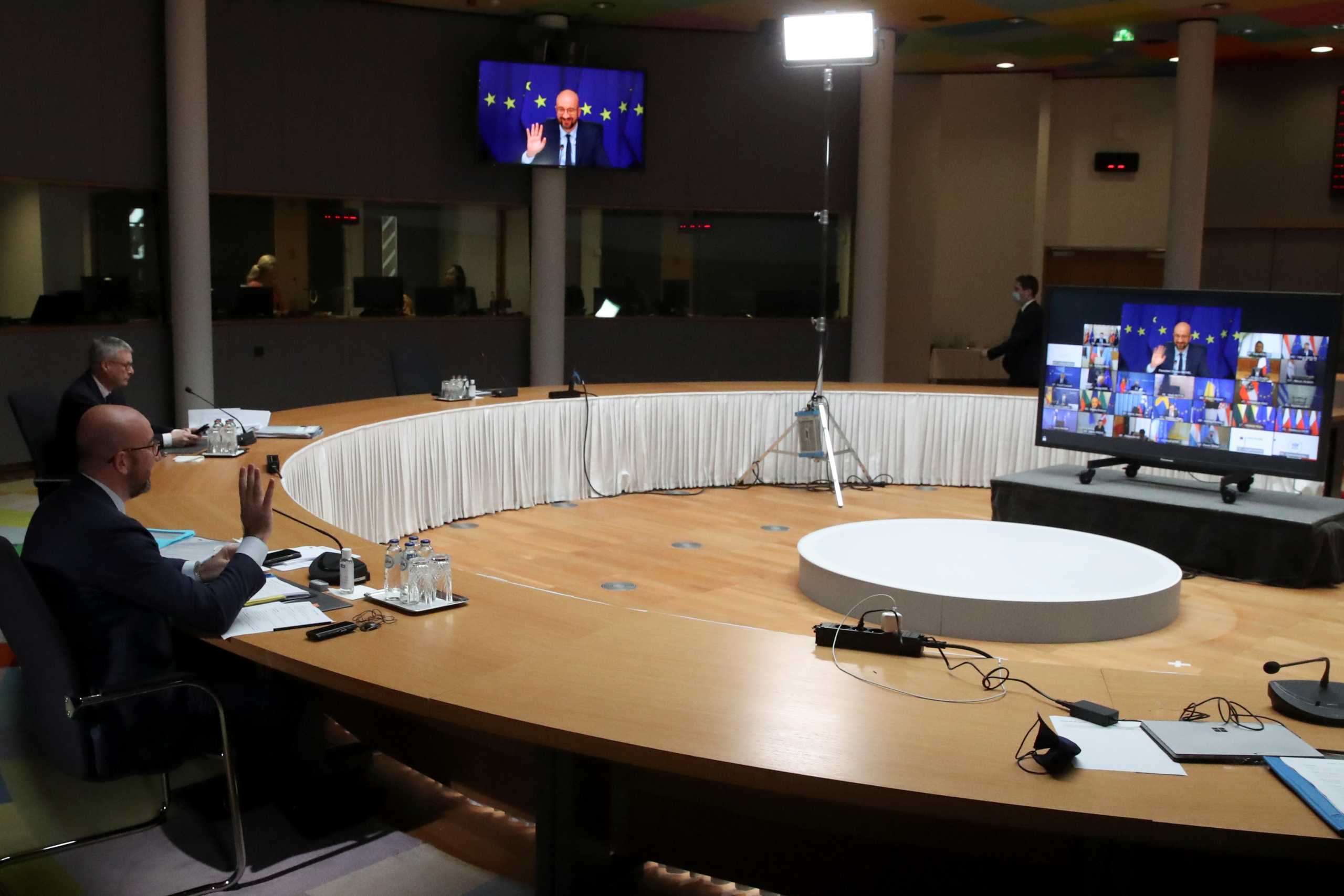 European Council President Charles Michel gestures at the beginning of a video conference with the leaders, during a EU summit in Brussels, Belgium March 25, 2021. REUTERS
