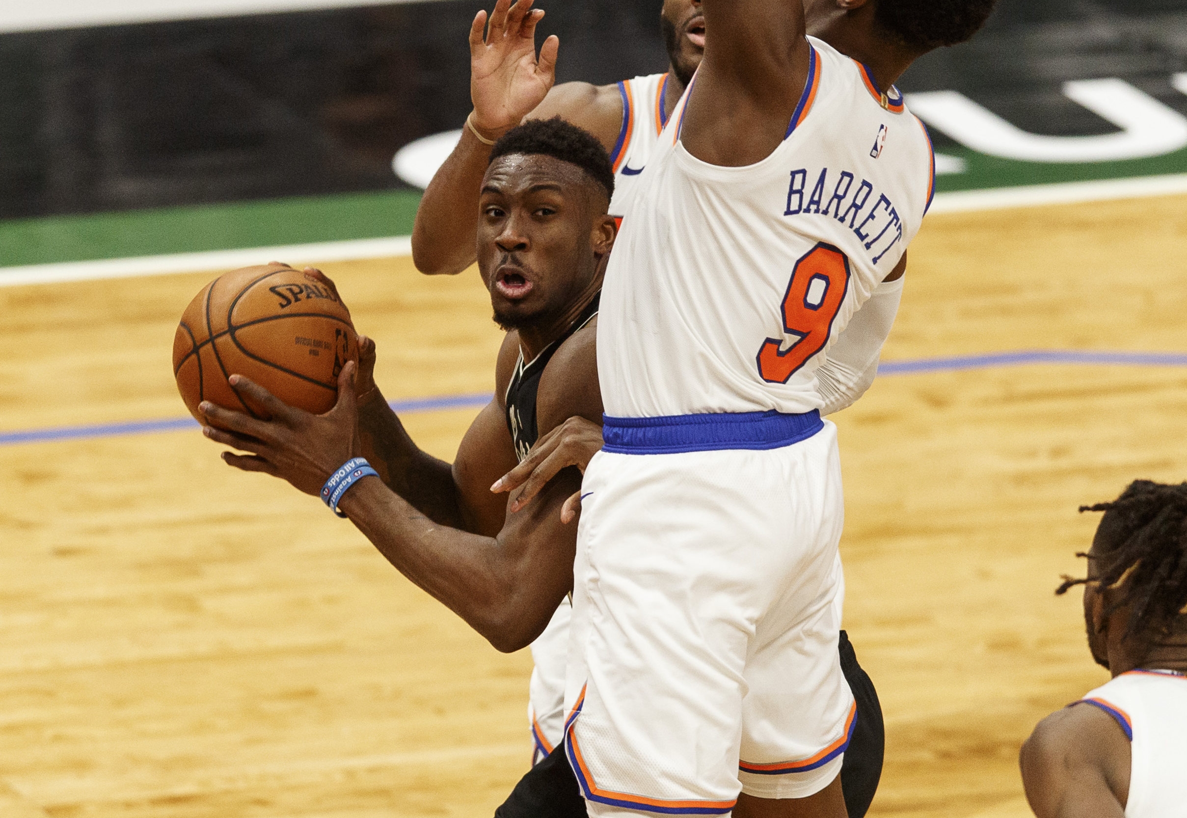 Mar 27, 2021; Milwaukee, Wisconsin, USA;  Milwaukee Bucks forward Thanasis Antetokounmpo (43) looks to shoot against New York Knicks guard RJ Barrett (9) during the third quarter at Fiserv Forum. Mandatory Credit: Jeff Hanisch-USA TODAY Sports