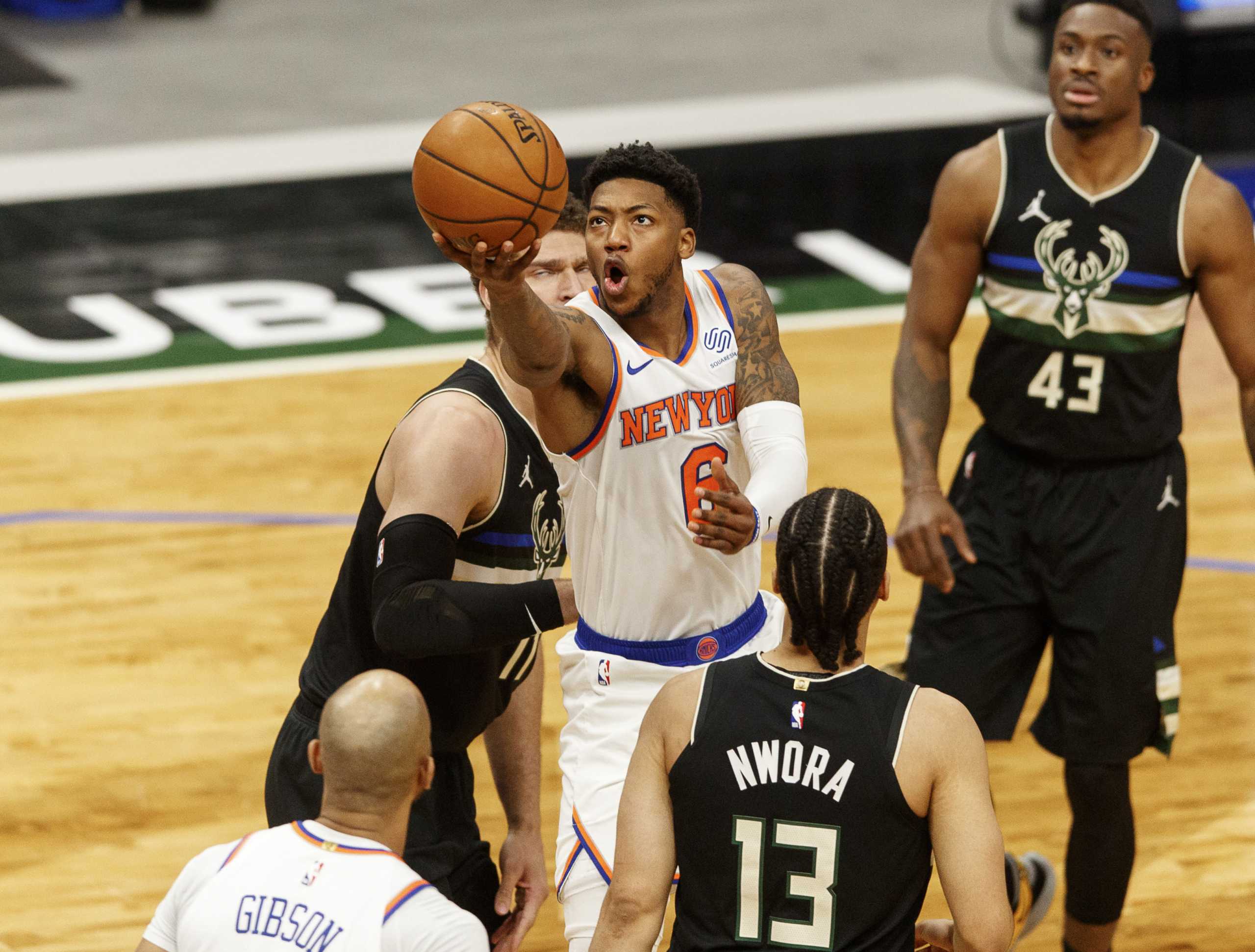 Mar 27, 2021; Milwaukee, Wisconsin, USA;  New York Knicks guard Elfrid Payton (6) shoots during the first quarter against the Milwaukee Bucks at Fiserv Forum. Mandatory Credit: Jeff Hanisch-USA TODAY Sports