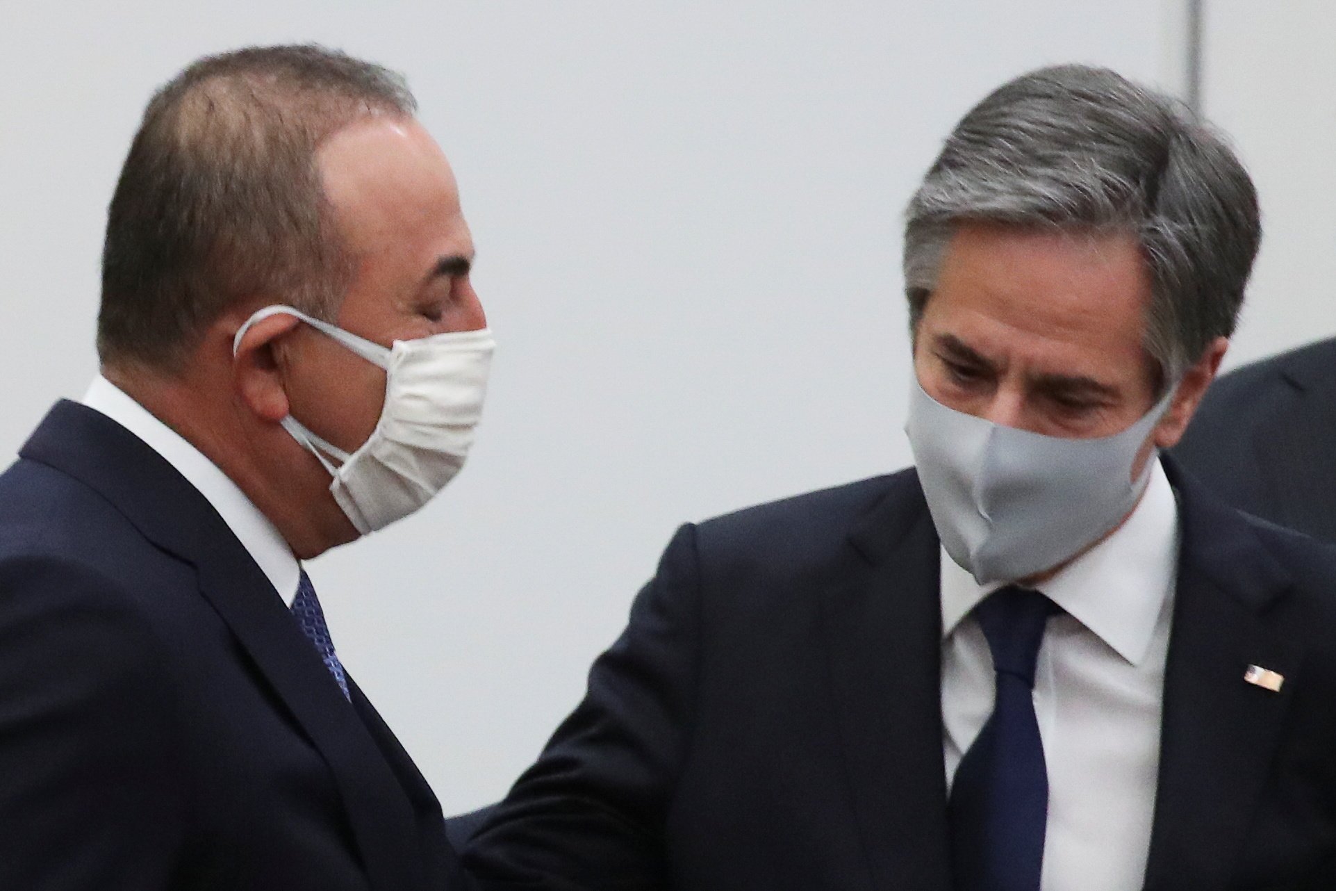 Turkish Foreign Minister Mevlut Cavusoglu and U.S. Secretary of State Antony J. Blinken arrive to take part in a North Atlantic Council (NAC) at foreign ministers level, at NATO headquarters in Brussels, Belgium March 23, 2021. REUTERS