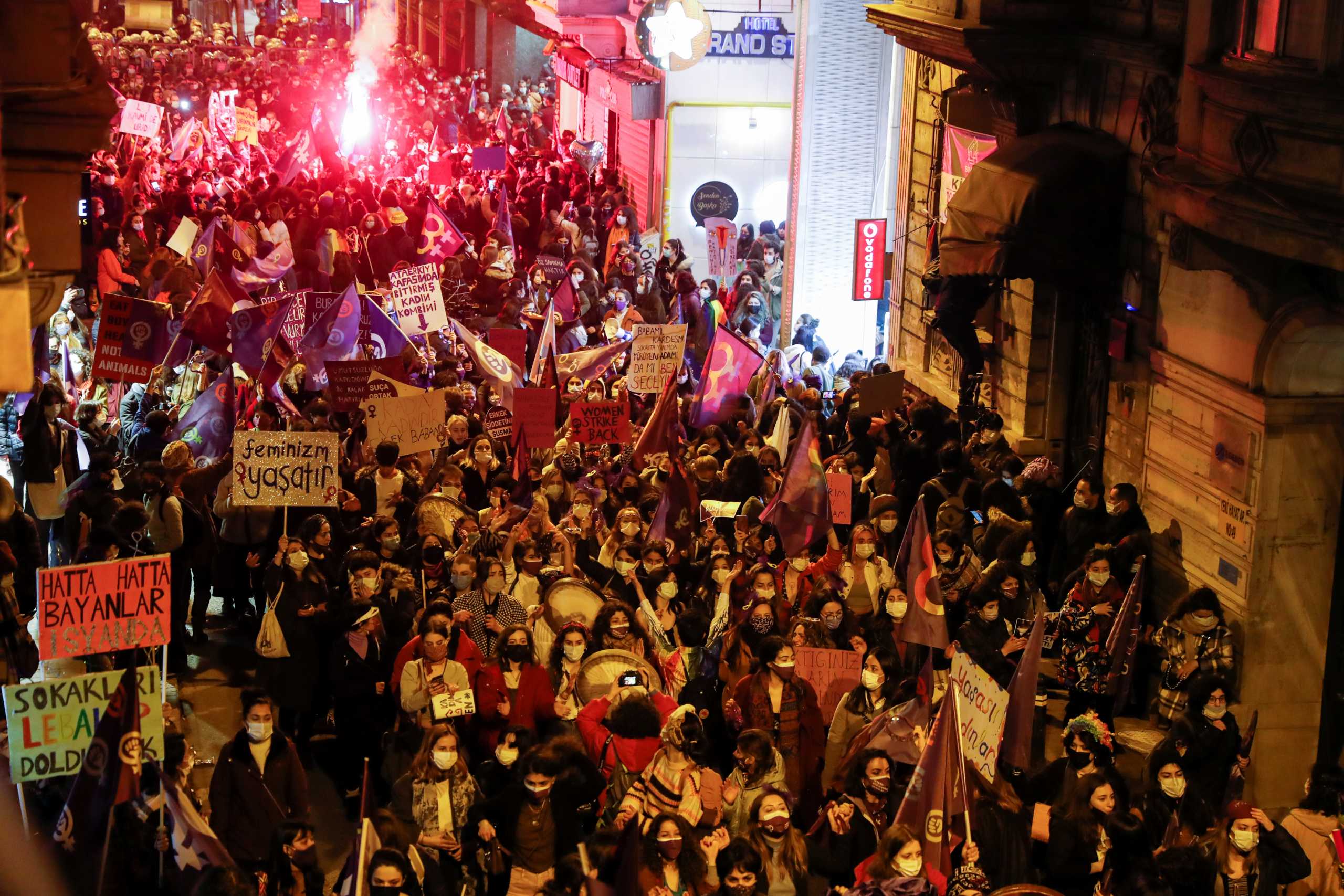 Demonstrators light flares during a rally to mark International Women's Day in Istanbul, Turkey March 8, 2021. REUTERS