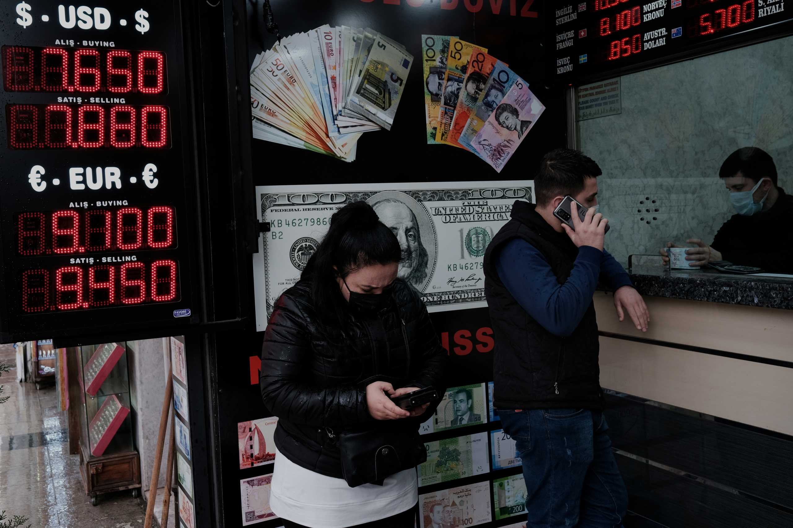 People wait to change money at a currency exchange office in Istanbul, Turkey March 22, 2021. REUTERS