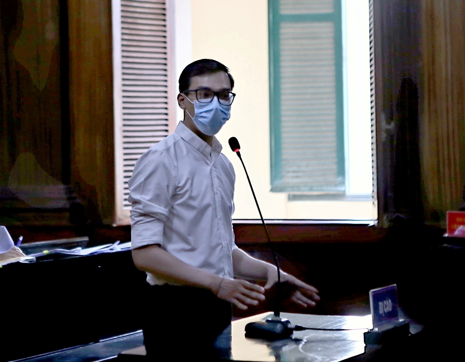 Vietnam Airlines flight attendant Duong Tan Hau, addresses the court before being found guilty of violating COVID-19 quarantine rules and handed a two year suspended prison term in Ho Chi Minh City, Vietnam March 30, 2021. Mandatory credit VNA via REUTERS   THIS IMAGE HAS BEEN SUPPLIED BY A THIRD PARTY. NO RESALES. NO ARCHIVES. MANDATORY CREDIT. VIETNAM OUT. NO COMMERCIAL OR EDITORIAL SALES IN VIETNAM.