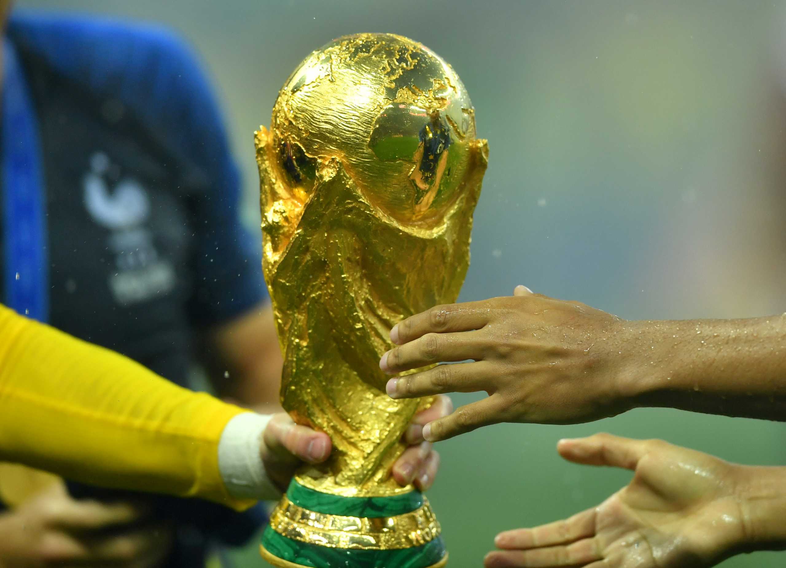FILE PHOTO: Soccer Football - World Cup - Final - France v Croatia - Luzhniki Stadium, Moscow, Russia - July 15, 2018  France's Hugo Lloris passes the trophy as they celebrate winning the World Cup  REUTERS