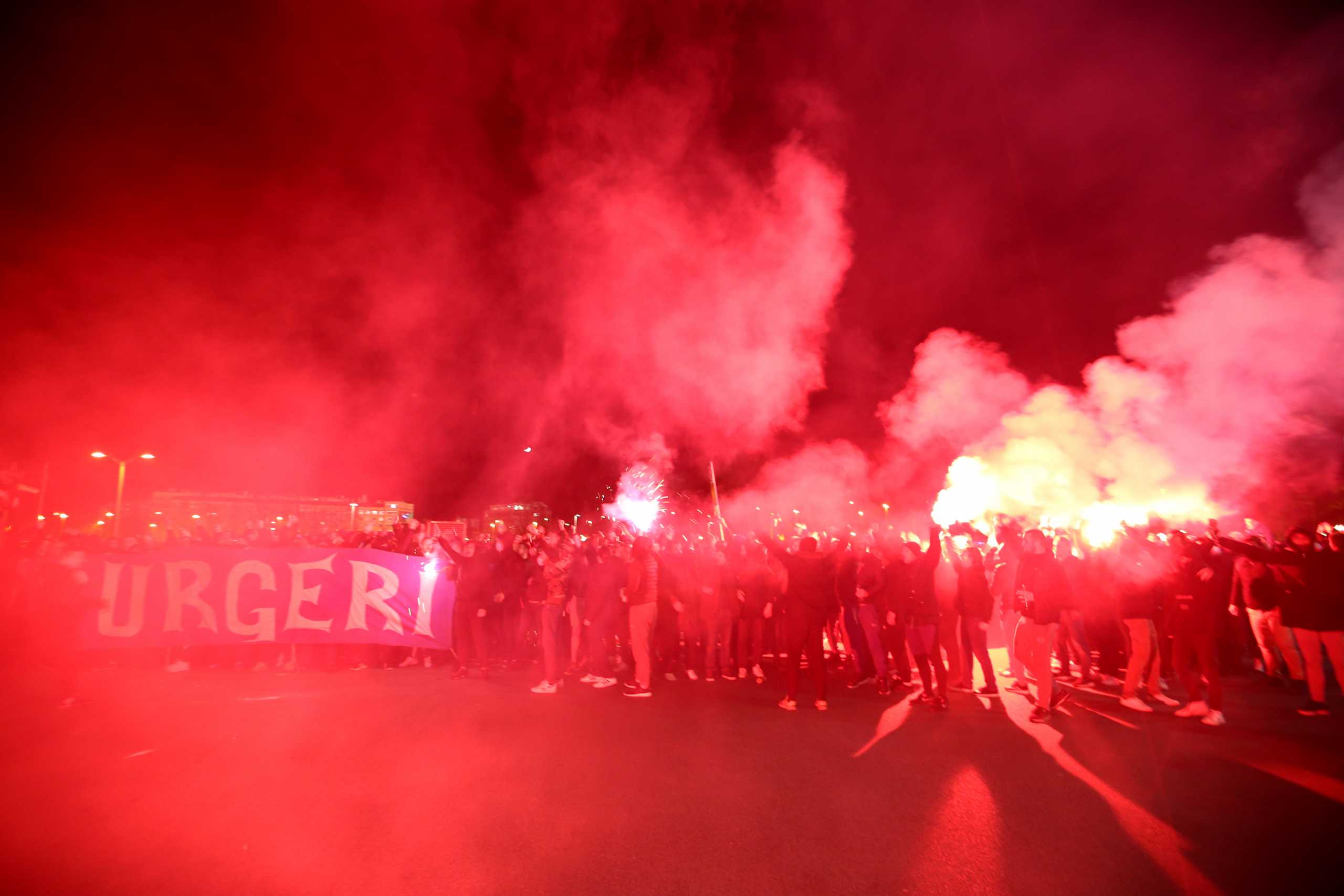 Soccer Football - Europa League - Round of 16 Second Leg - Dinamo Zagreb v Tottenham Hotspur - Stadion Maksimir, Zagreb, Croatia - March 18, 2021 Dinamo Zagreb fans light flares as they celebrate after the match REUTERS