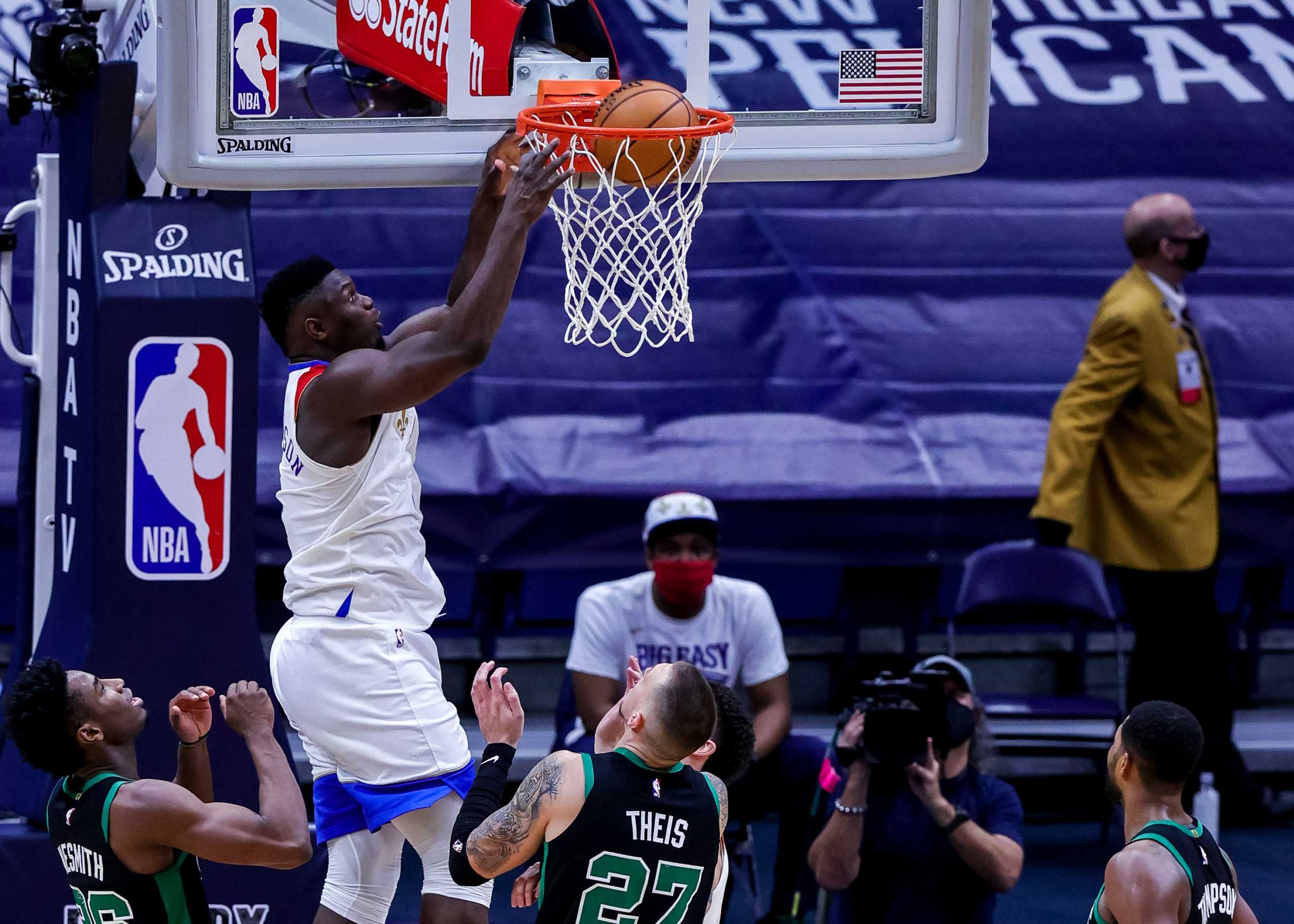 Feb 21, 2021; New Orleans, Louisiana, USA;  New Orleans Pelicans forward Zion Williamson (1) dunks the ball against Boston Celtics center Daniel Theis (27) during the second half at Smoothie King Center. Mandatory Credit: Stephen Lew-USA TODAY Sports