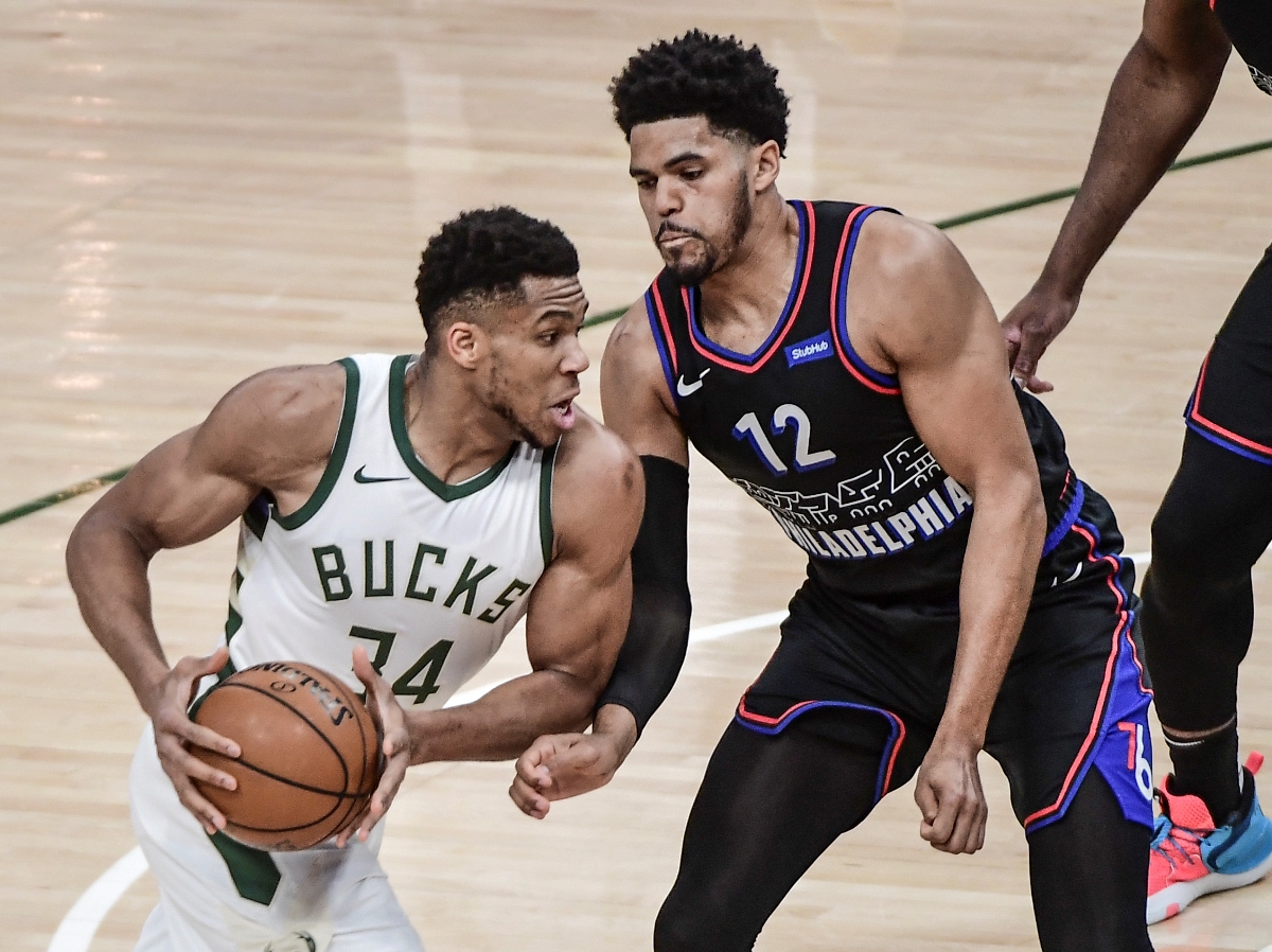 Apr 22, 2021; Milwaukee, Wisconsin, USA; Milwaukee Bucks forward Giannis Antetokounmpo (34) drives for the basket against Philadelphia 76ers forward Tobias Harris (12) in the first quarter at Fiserv Forum. Mandatory Credit: Benny Sieu-USA TODAY Sports