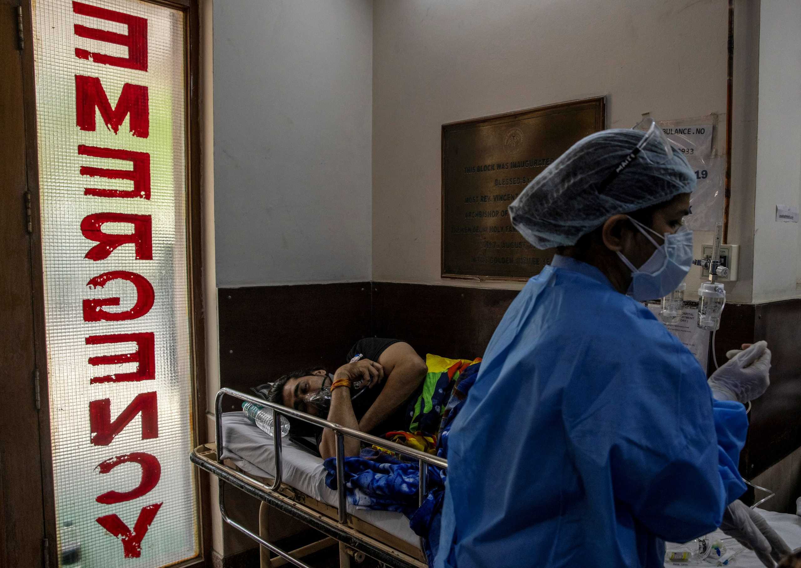 A patient suffering from the coronavirus disease (COVID-19) receives treatment inside the emergency ward at Holy Family hospital in New Delhi, India, April 29, 2021. REUTERS