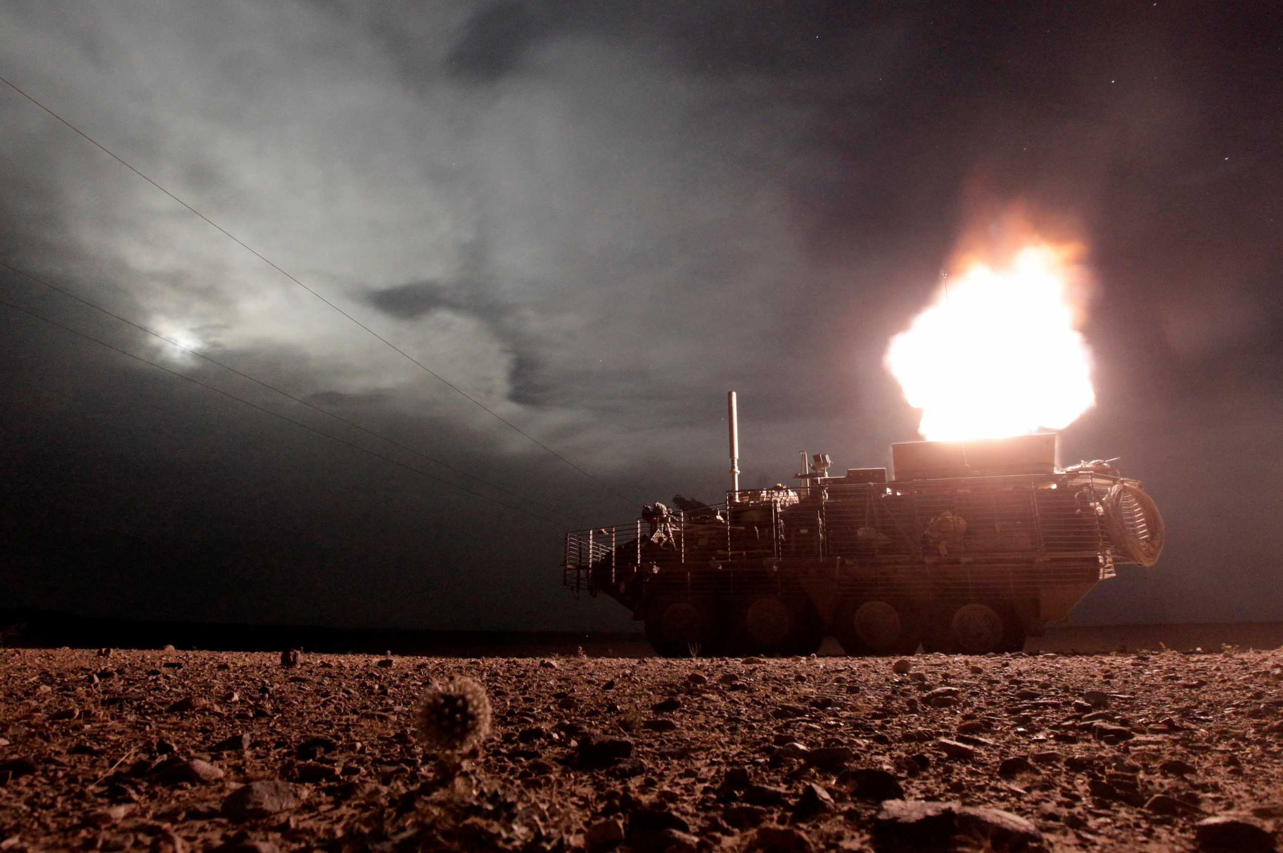 FILE PHOTO: A Stryker armoured vehicle from the U.S. Army's MGS Platoon, Alpha Company, 4-23 Infantry Battalion, 5th Stryker Brigade Combat Team fires a 120mm mortar during a night patrol in Kandahar, Afghanistan, April 27, 2010.         REUTERS