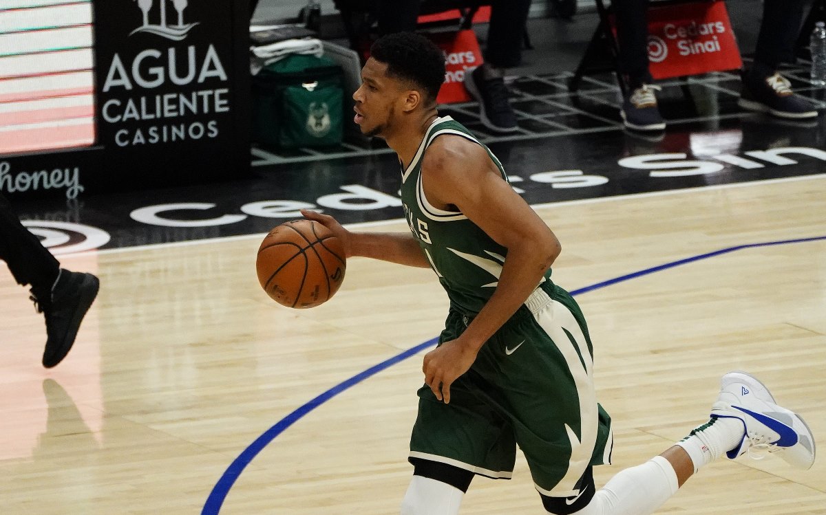 Mar 29, 2021; Los Angeles, California, USA; Milwaukee Bucks forward Giannis Antetokounmpo (34) moves the ball up court against the Los Angeles Clippers during the first half at Staples Center. Mandatory Credit: Gary A. Vasquez-USA TODAY Sports