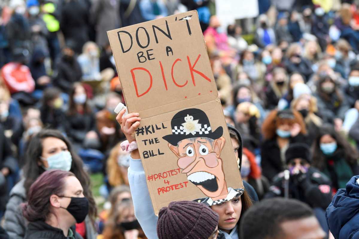 SENSITIVE MATERIAL. THIS IMAGE MAY OFFEND OR DISTURB A demonstrator holds a placard during a protest in London, Britain, April 3, 2021. REUTERS