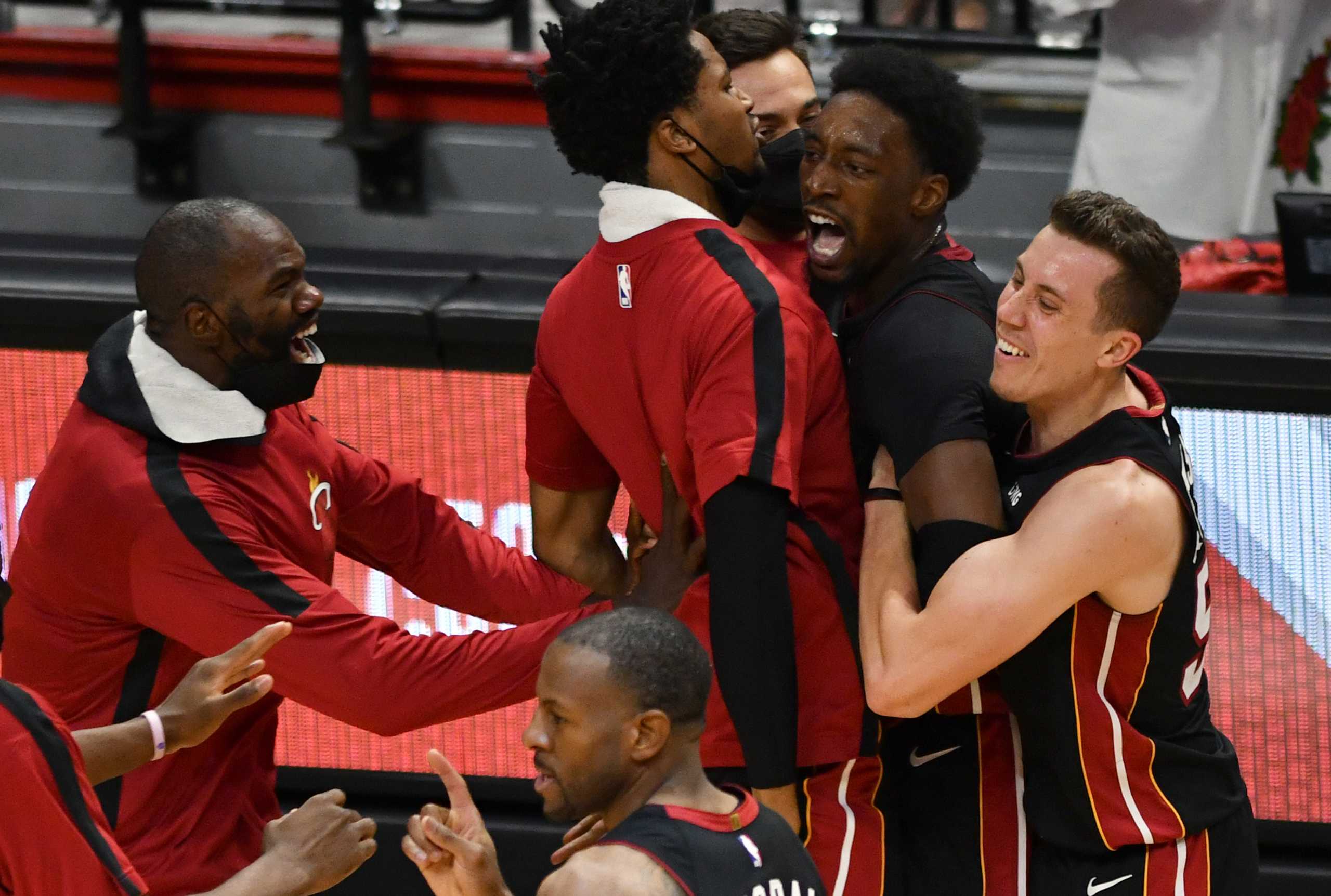 Apr 18, 2021; Miami, Florida, USA; Miami Heat center Bam Adebayo (13) celebrates a winning shot over the Brooklyn Nets with teammates at American Airlines Arena. Mandatory Credit: Jim Rassol-USA TODAY Sports