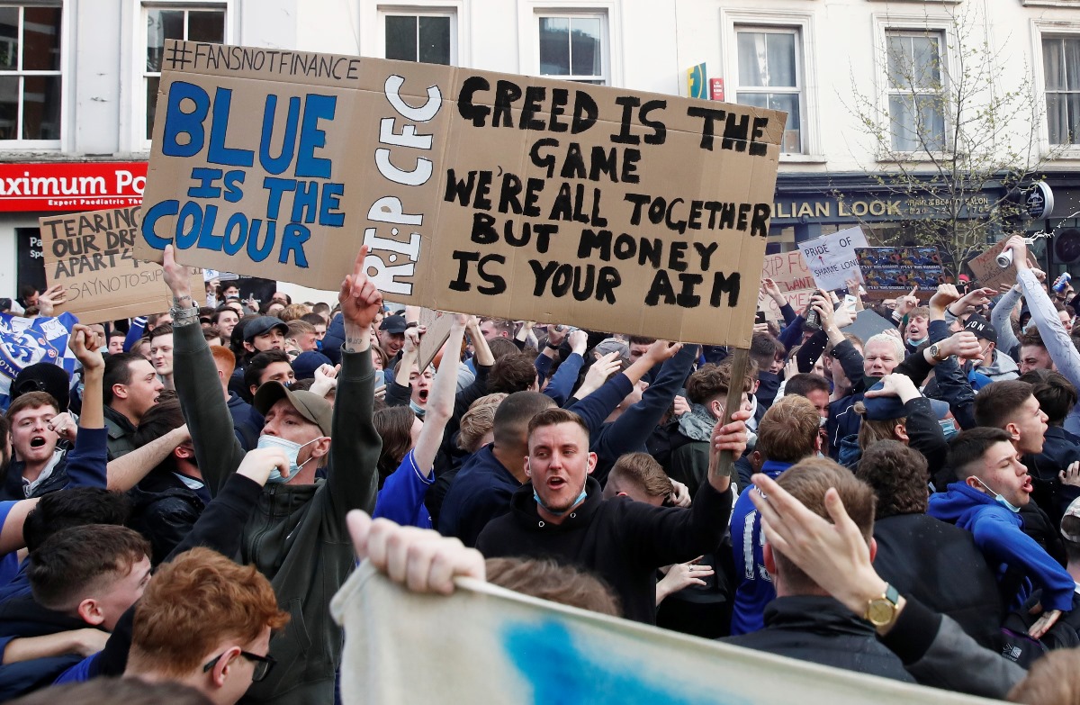 Soccer Football - Premier League - Chelsea v Brighton & Hove Albion - Stamford Bridge, London, Britain - April 20, 2021 Chelsea fans protest the planned European Super League outside the stadium before the match. It was announced twelve of Europe's top football clubs will launch a breakaway REUTERS