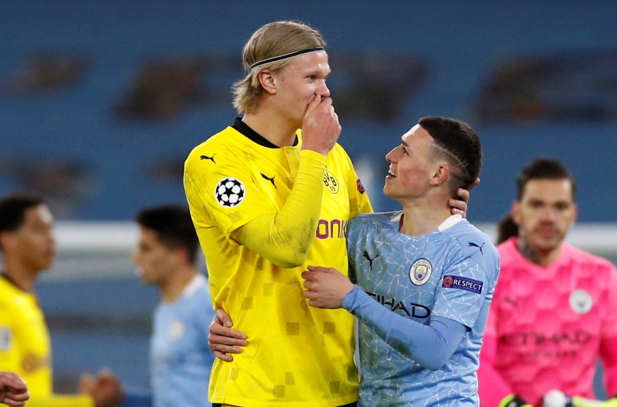 Soccer Football - Champions League - Quarter Final - First Leg - Manchester City v Borussia Dortmund - Etihad Stadium, Manchester, Britain - April 6, 2021 Borussia Dortmund's Erling Braut Haaland with Manchester City's Phil Foden after the match REUTERS